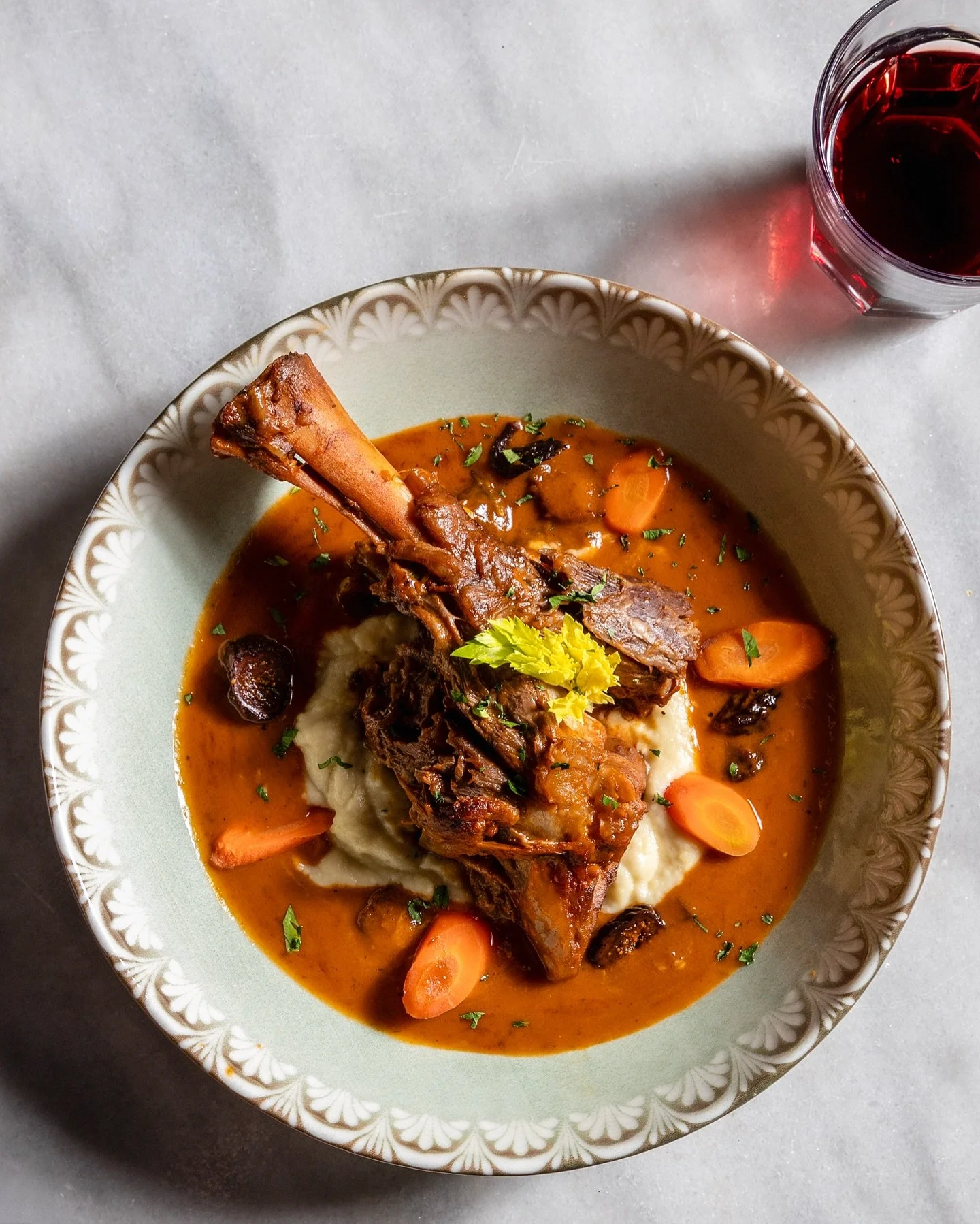 Craving something cozy? Look no further.

LAMB SHANK
parsnip puree . carrots . dried figs

Slow braised until fall-off-the-bone tender, served over silky parsnip puree with sweet carrots and dried figs. This is the kind of dish that makes you want to