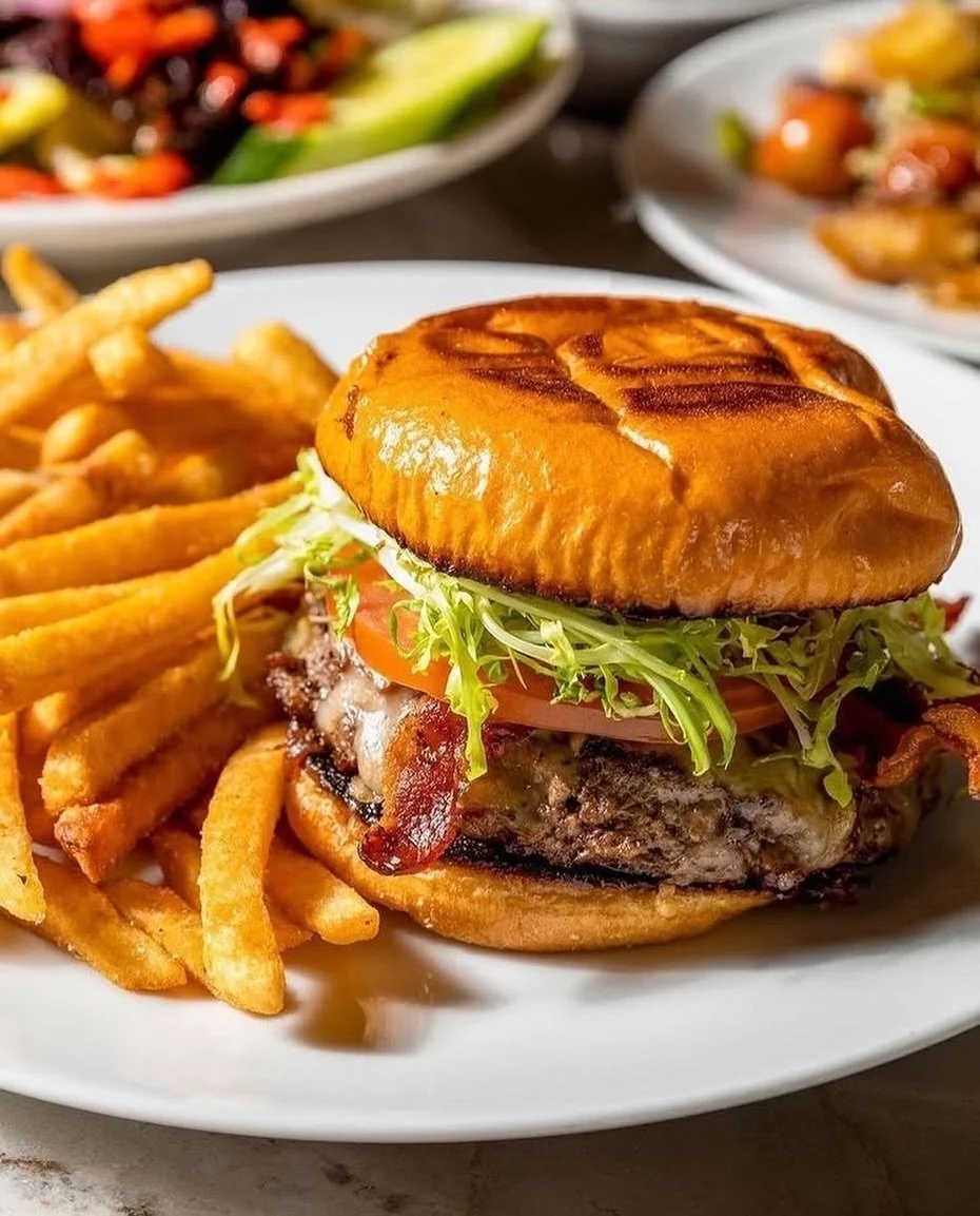 Lunch starts at 11 &ndash; Come grab a bite 🍔 🍺 🍟⁠

Stop by for lunch and enjoy our signature burger featuring creekstone farms black angus beef, applewood bacon, white cheddar, frisee, tomato, honey garlic aioli, onion marmalade, brioche bun, ser