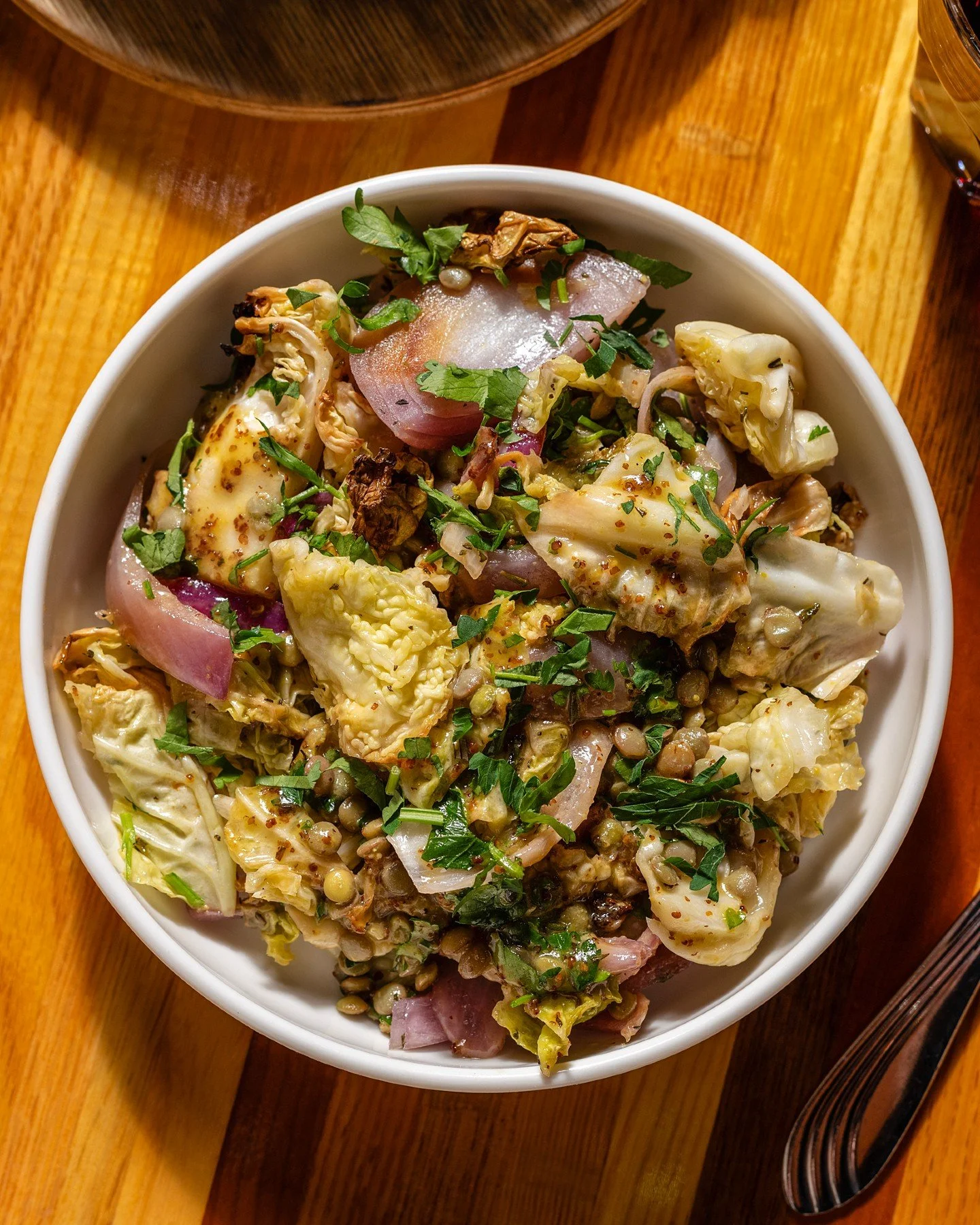 CABBAGE &amp; LENTILS, new to the menu.

Shallots. Rosemary. Parsley. Honey. Whole grain mustard. Sherry vinegar.

Layered in a way that keeps you going back for another bite. This one is as beautiful to eat as it is to look at.

Tap the link in our 