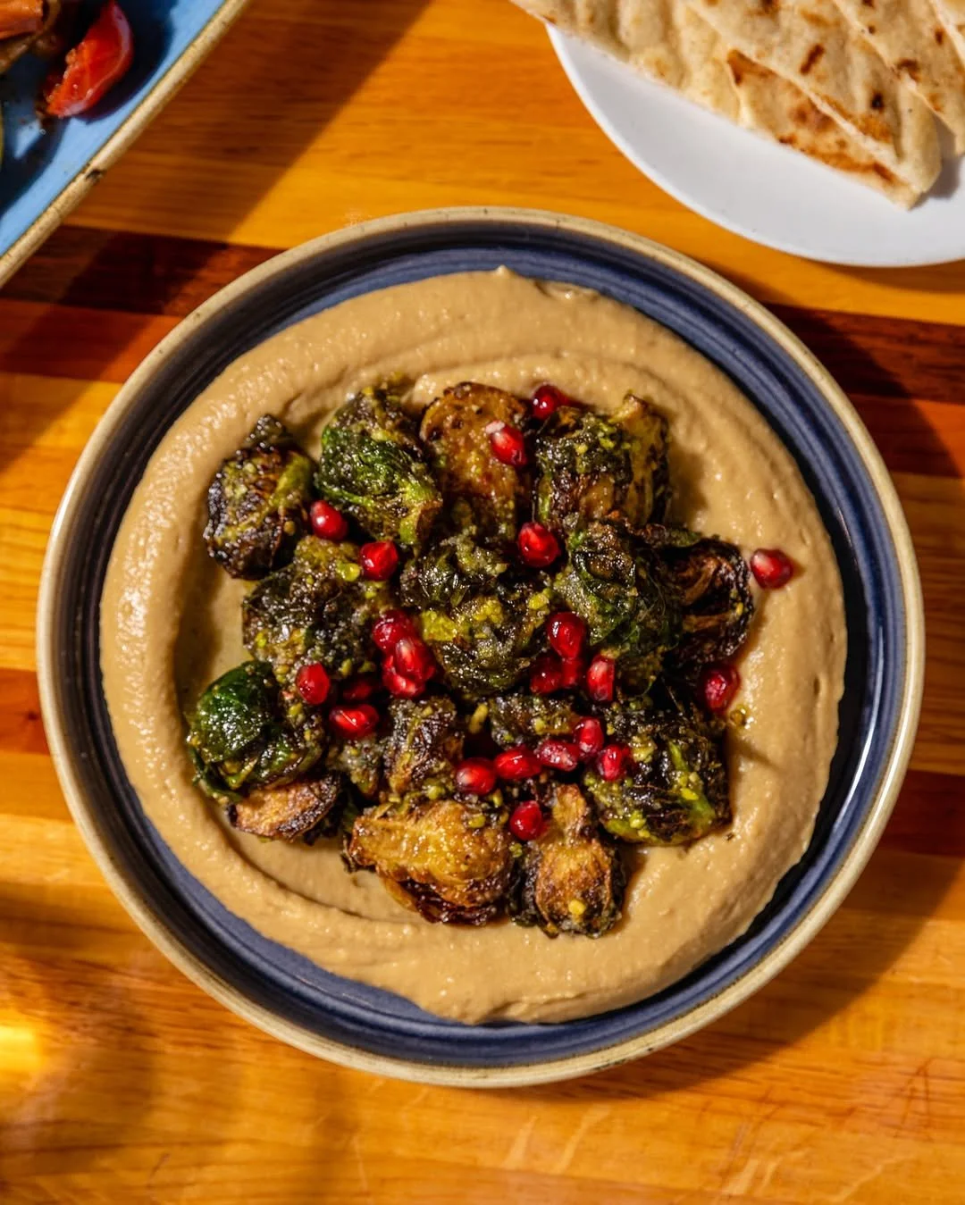A lunch made of small plates is a lunch with options.

HUMMUS
tahina, crispy garbanzo beans

BAKED FETA
michigan honey, sesame seeds, olives, pipparas, sun-dried tomato

SHISHITO PEPPERS
extra virgin olive oil, lemon, oregano, sea salt, chili flakes
