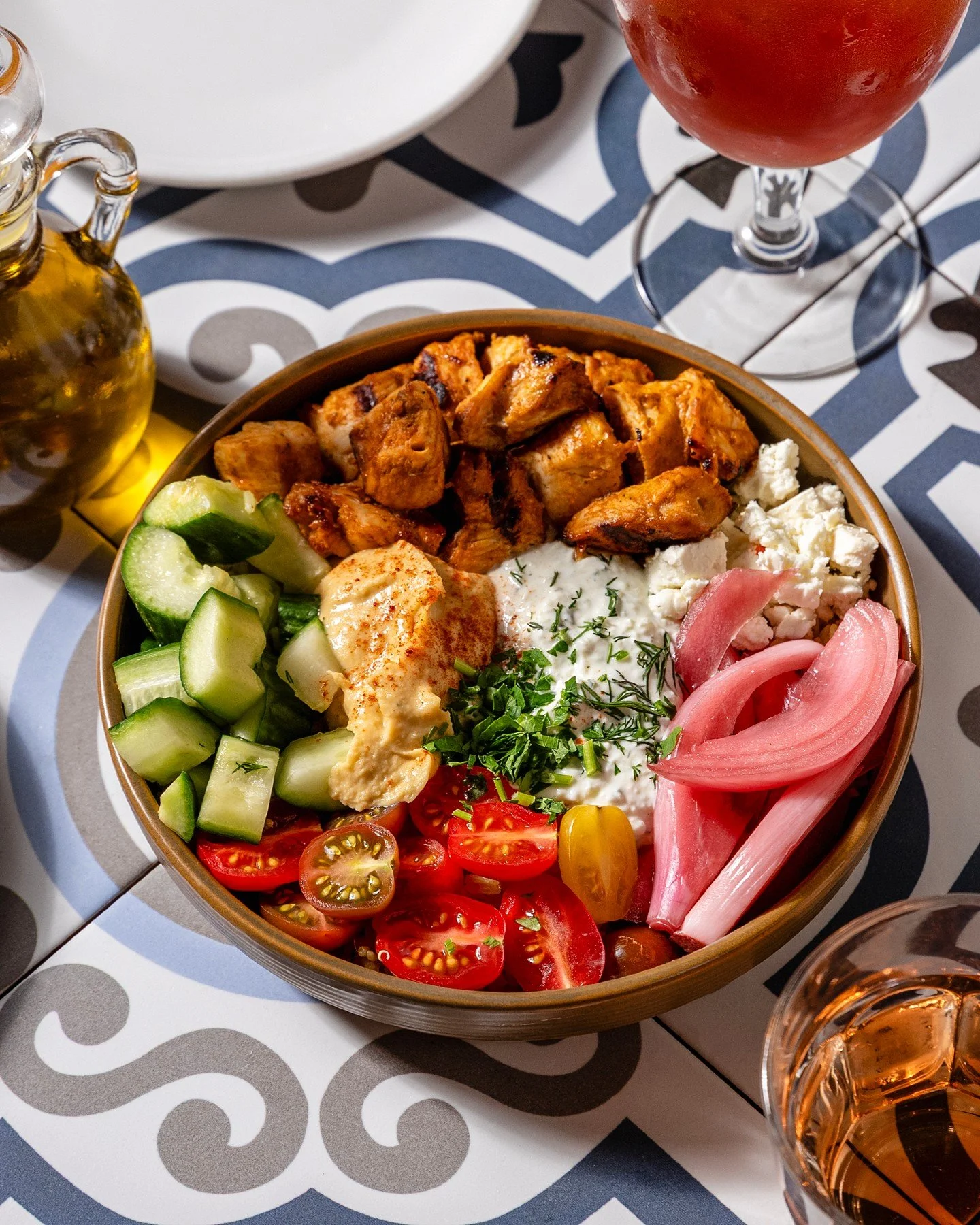 NEW To The Lunch Menu

RICE BOWL
It all sits on herbed saffron rice, gold and fragrant. Marinated chicken over the top. Tzatziki, cool and thick with dill. Hummus. Cherry tomatoes. Cucumber. Pickled onions for the sharp note. Feta.

Carryout via the 