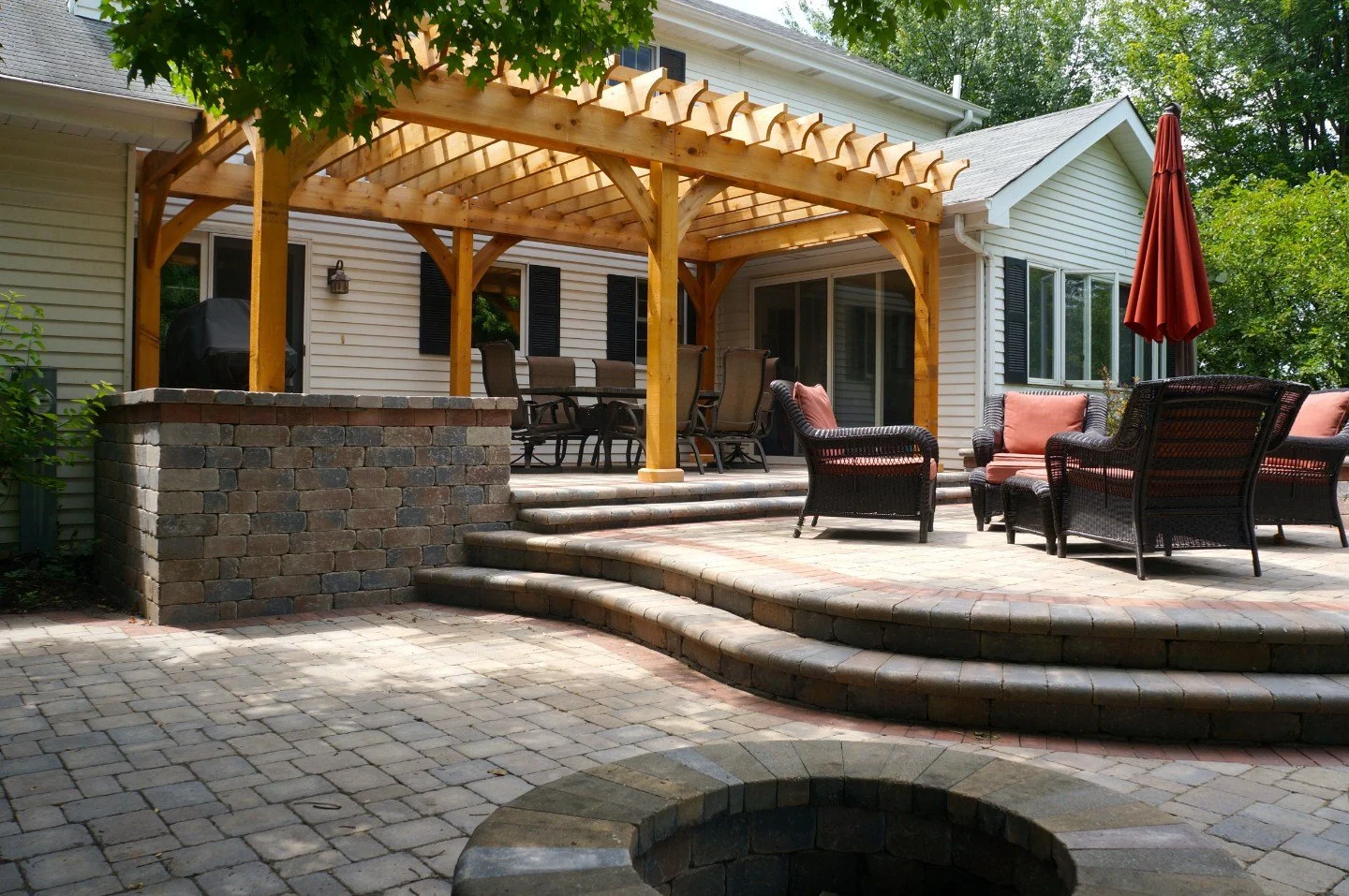 Brick patio with pergola and fire pit in Lisle, IL
