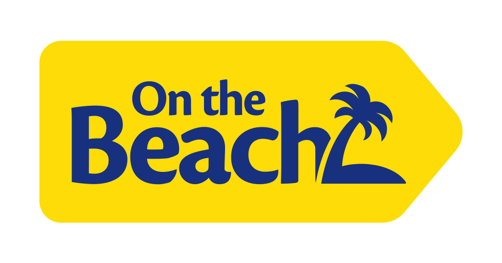 Yellow sign with the text 'On the Beach' in blue, featuring a palm tree illustration.