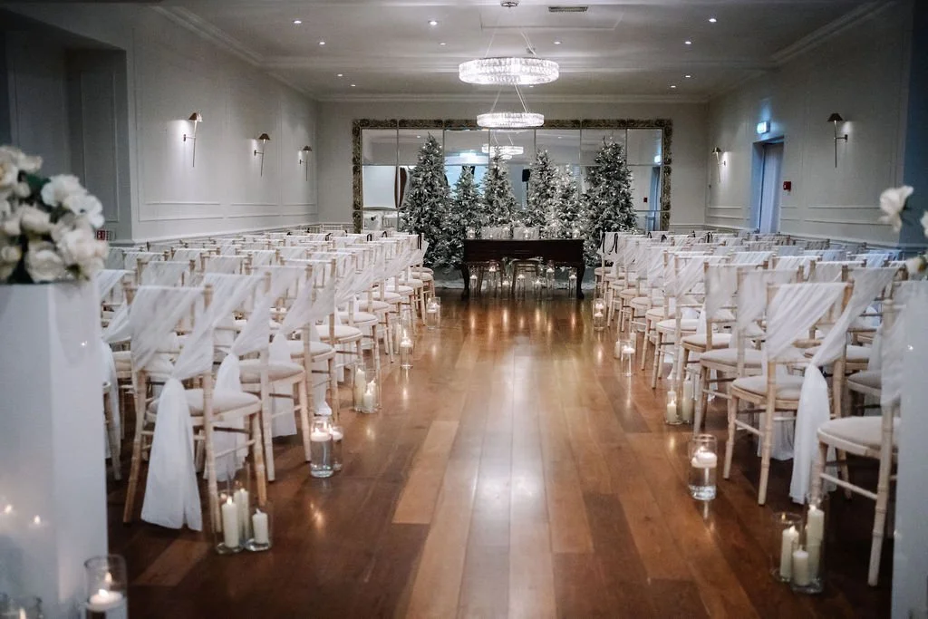 Winter wedding ceremony with Christmas trees at Sparth House wedding venue Lancashire