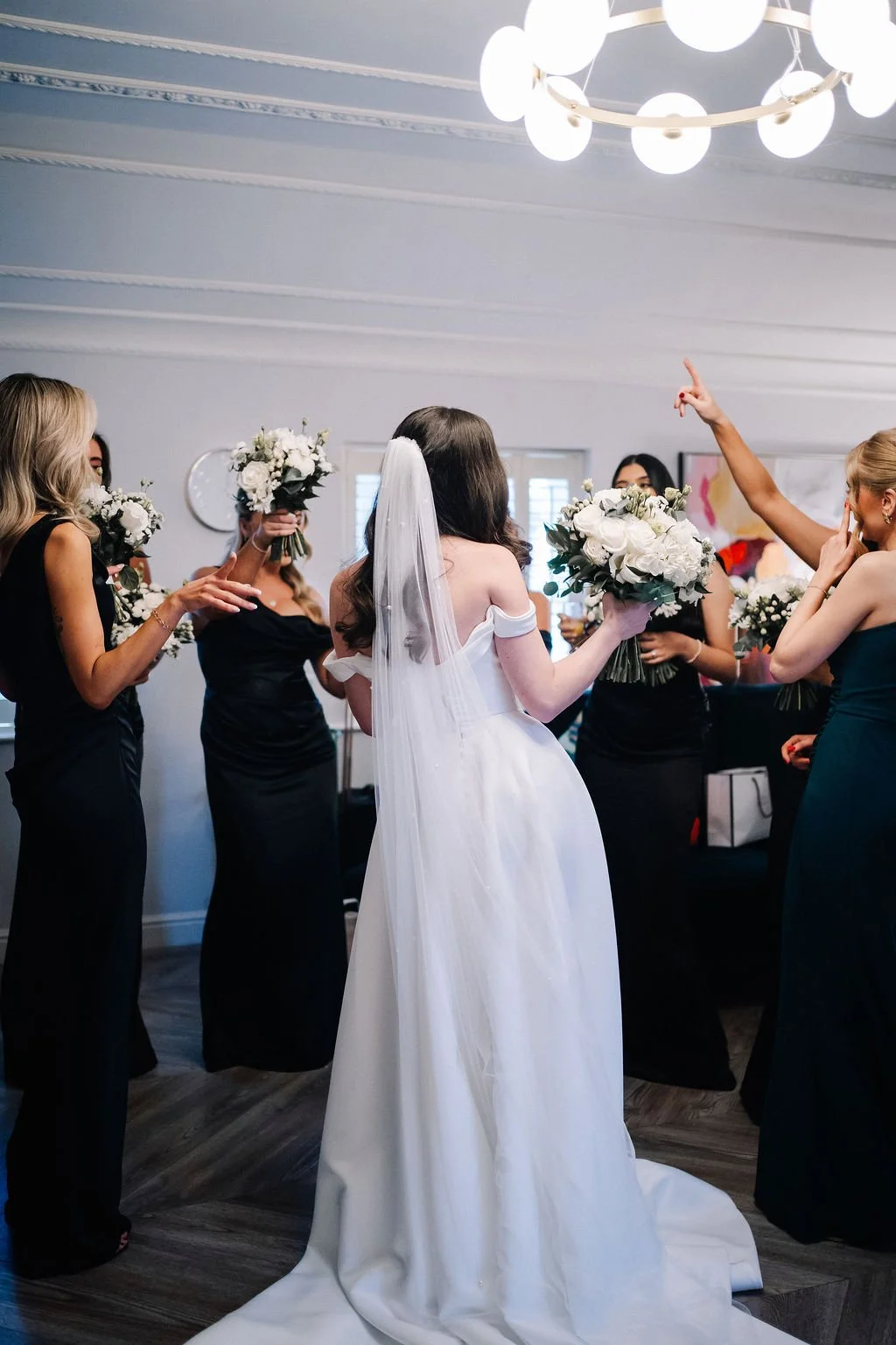 Bridesmaids celebrating with bouquets at Sparth House wedding venue Lancashire