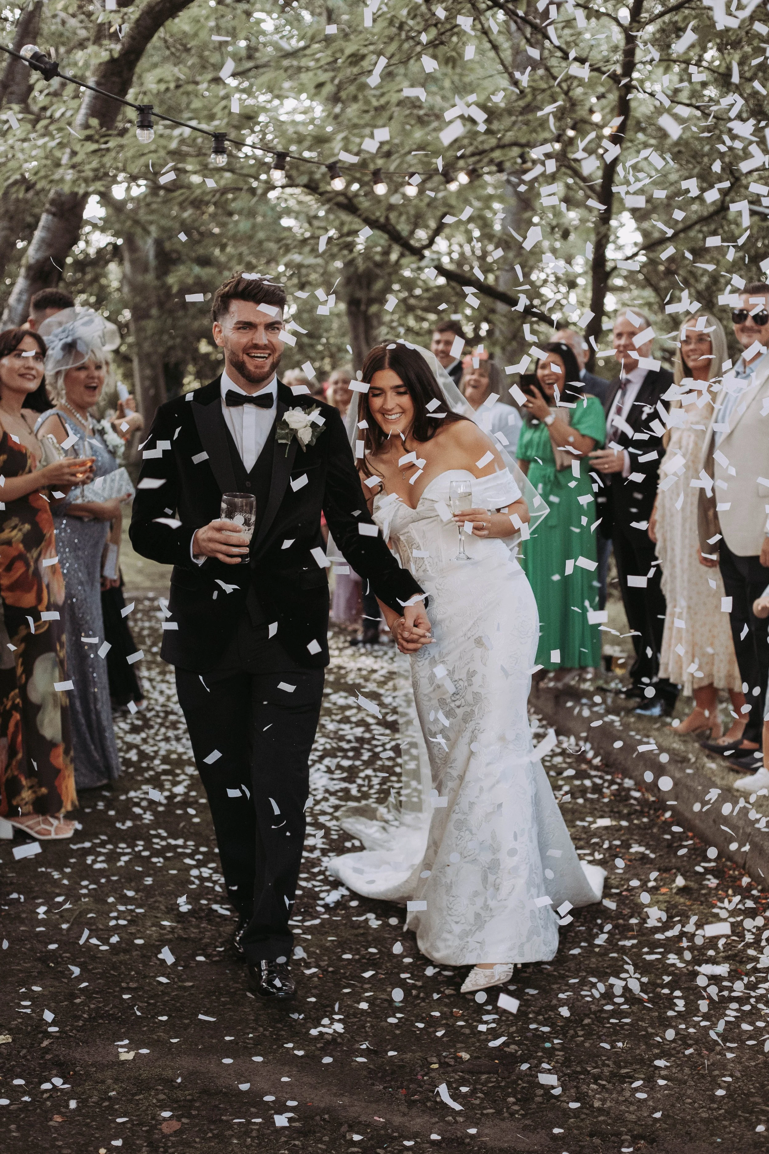 Bride and Groom walking down confetti lane at Sparth House