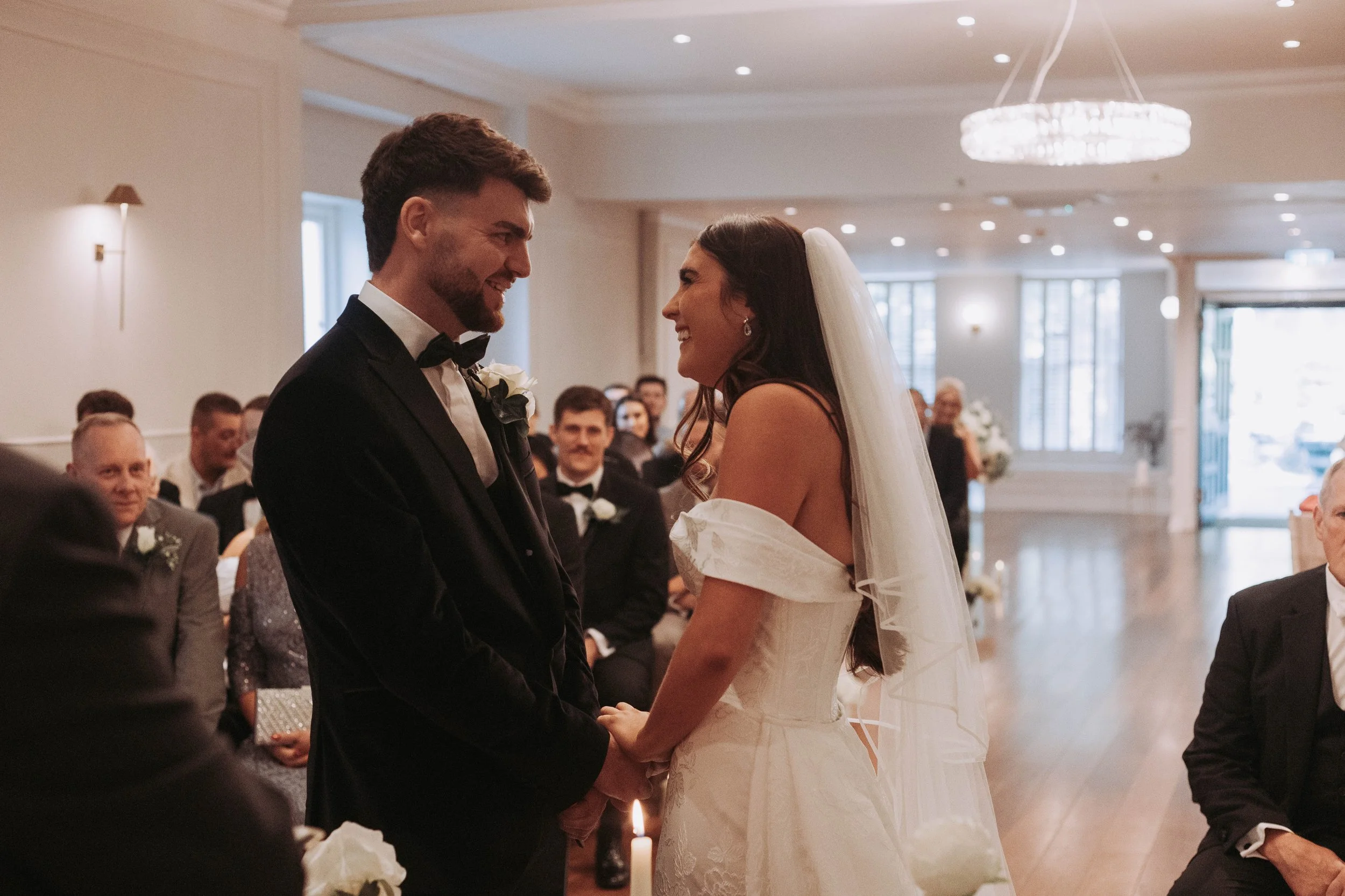 Wedding ceremony at Sparth House wedding venue Lancashire with guests watching couple