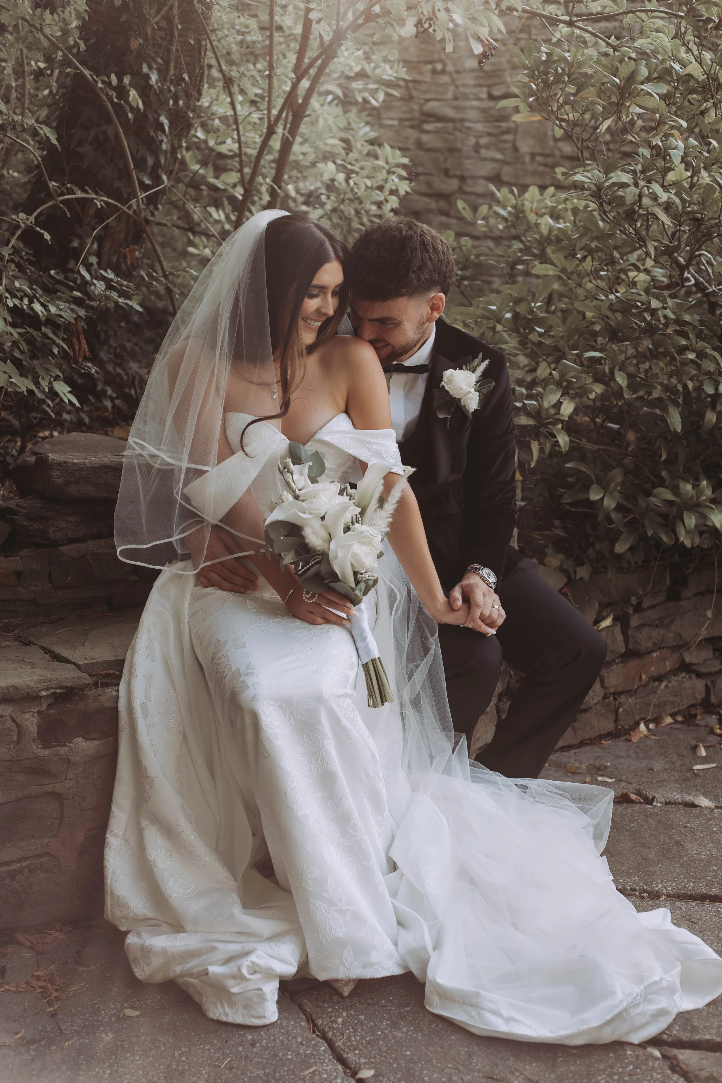 Wedding Couple having a private moment in garden