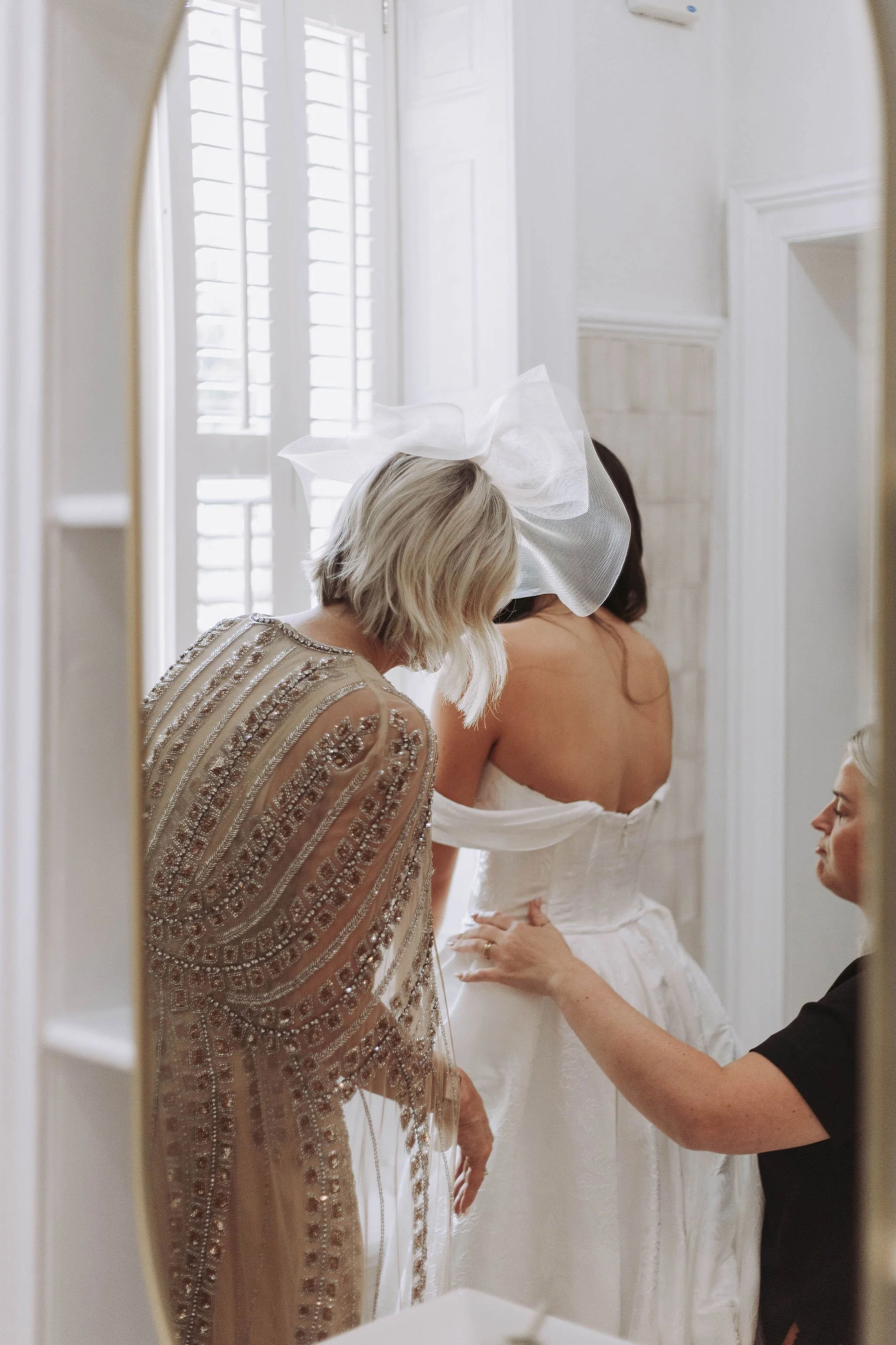 Bride getting ready with family in bridal suite at Sparth House wedding venue Lancashire