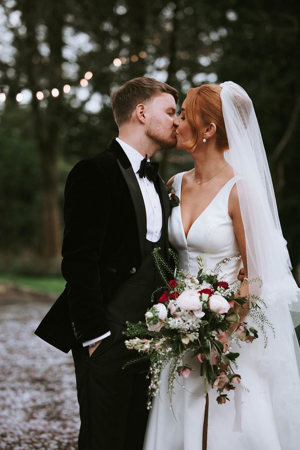 Couple kissing in Sparth House gardens