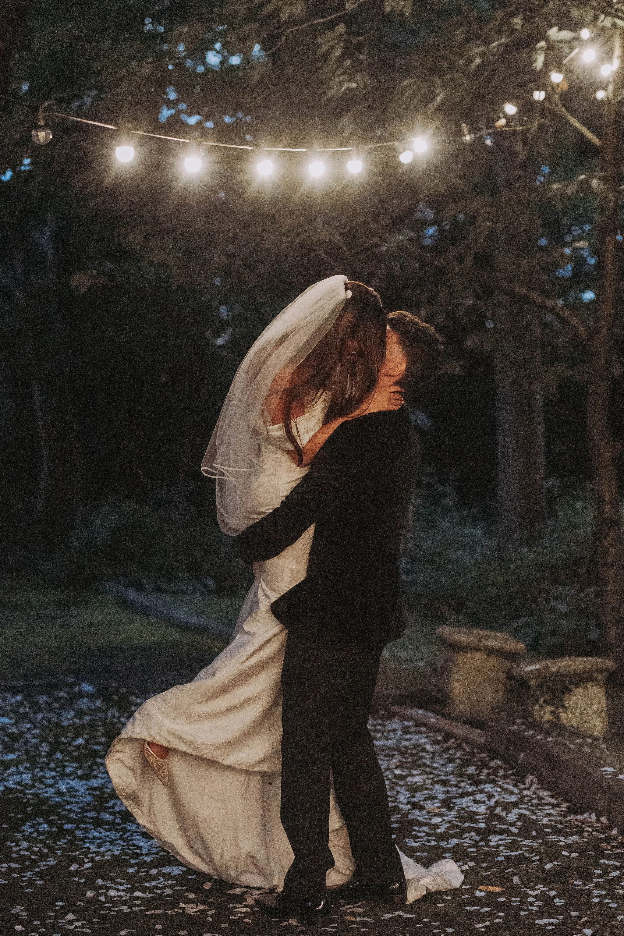 Bride and groom first dance lift at Sparth House wedding venue Lancashire evening reception on confetti lane