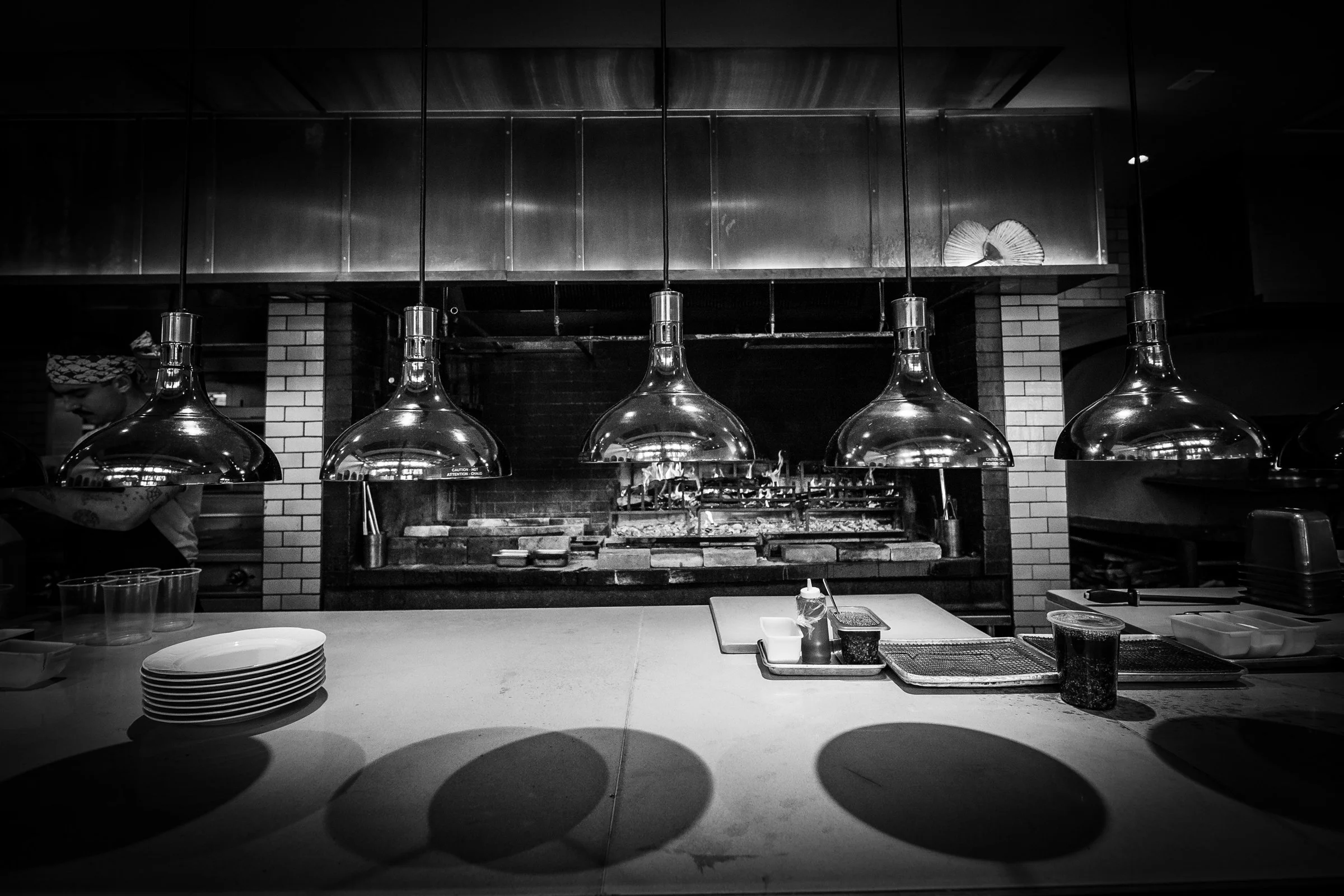 Metal lights hang in a kitchen designed by KRBS.