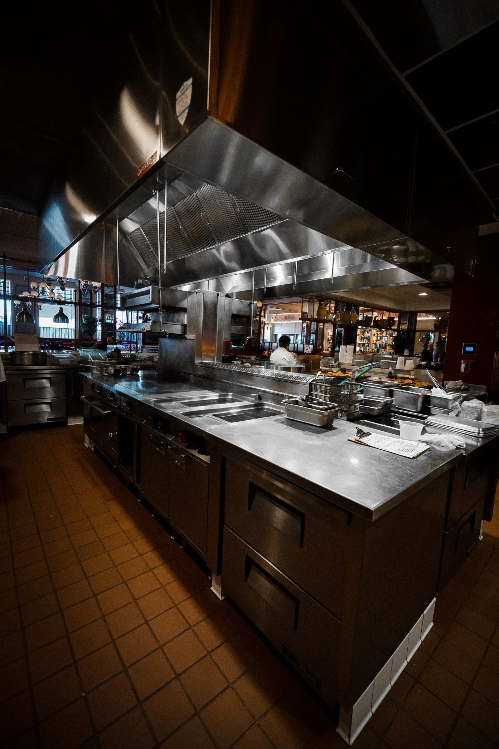 Various kitchen equipment in a foodservice space designed by KRBS. 