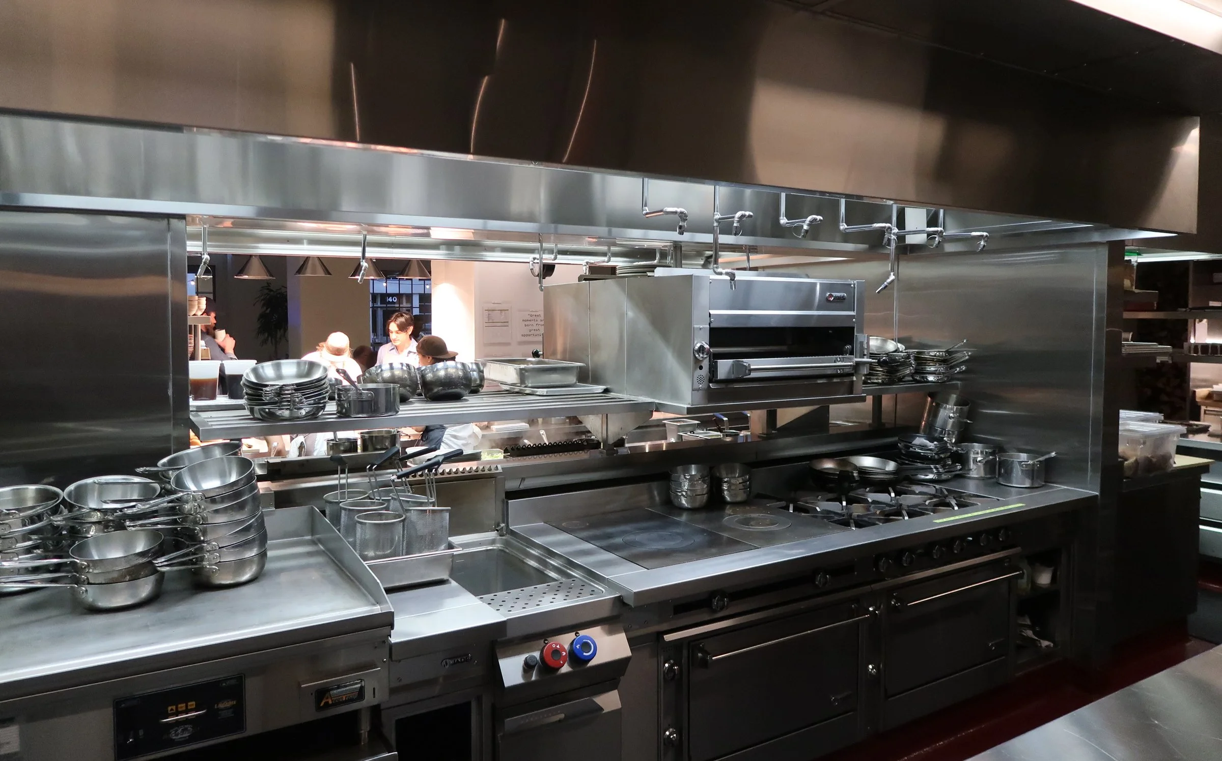 Chefs working in a kitchen designed by KRBS.