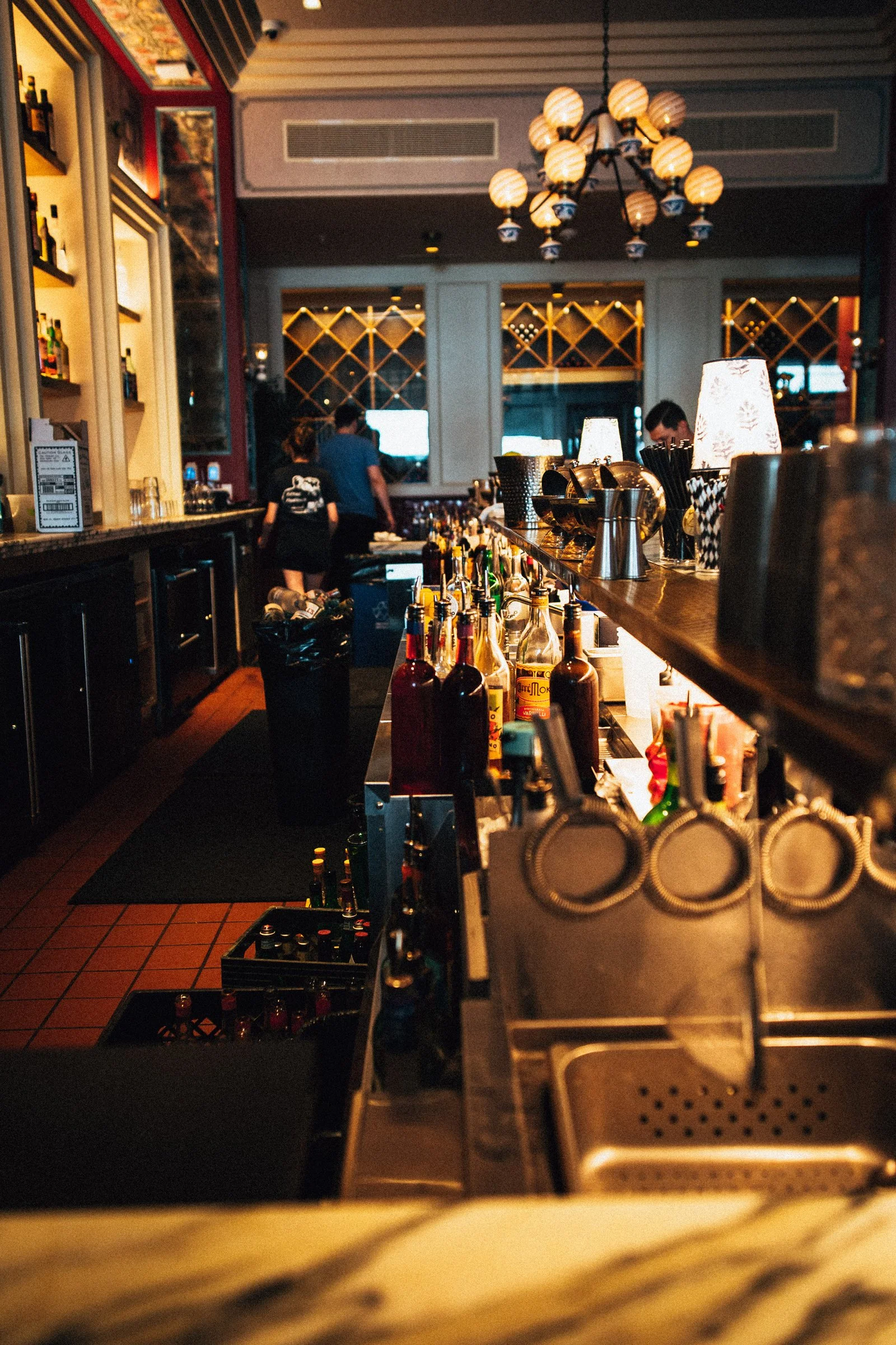 Looking behind a bar that was designed by KRBS. 