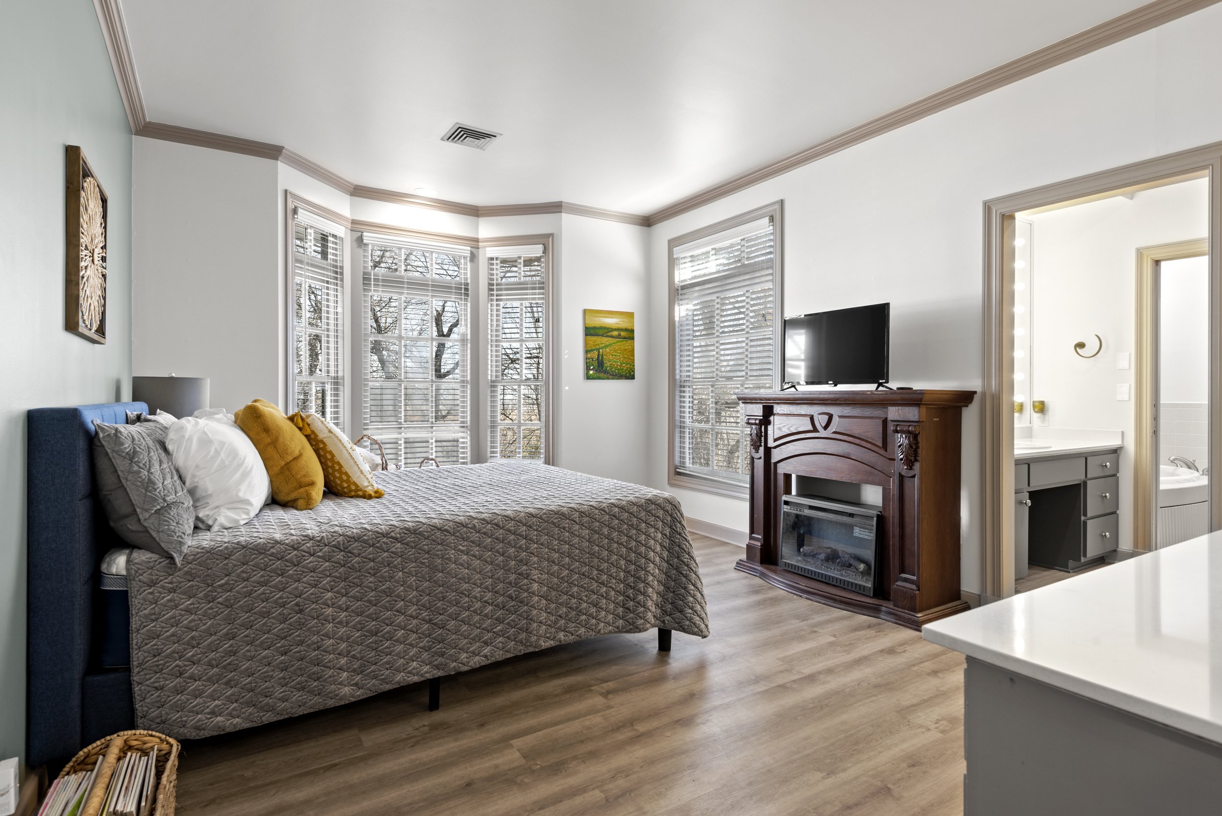 The Executive Suite has a queen bed, fireplace, smart tv, and private ensuite.