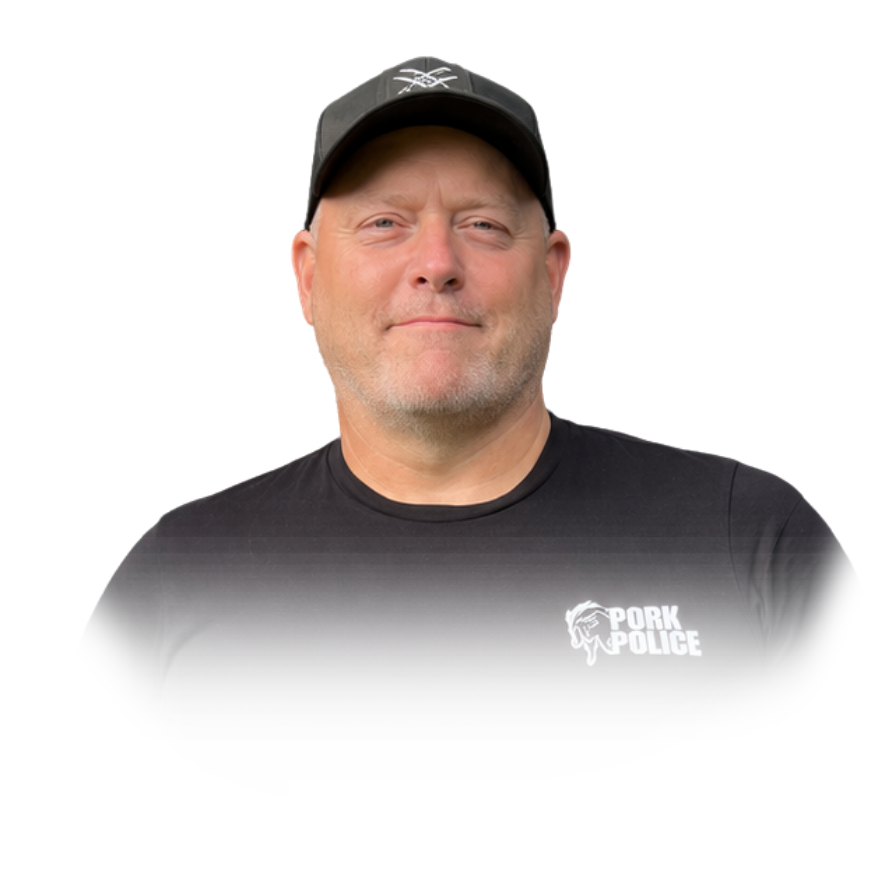 A man wearing a black cap and black t-shirt with a "Pork Police" logo, standing against a plain background.