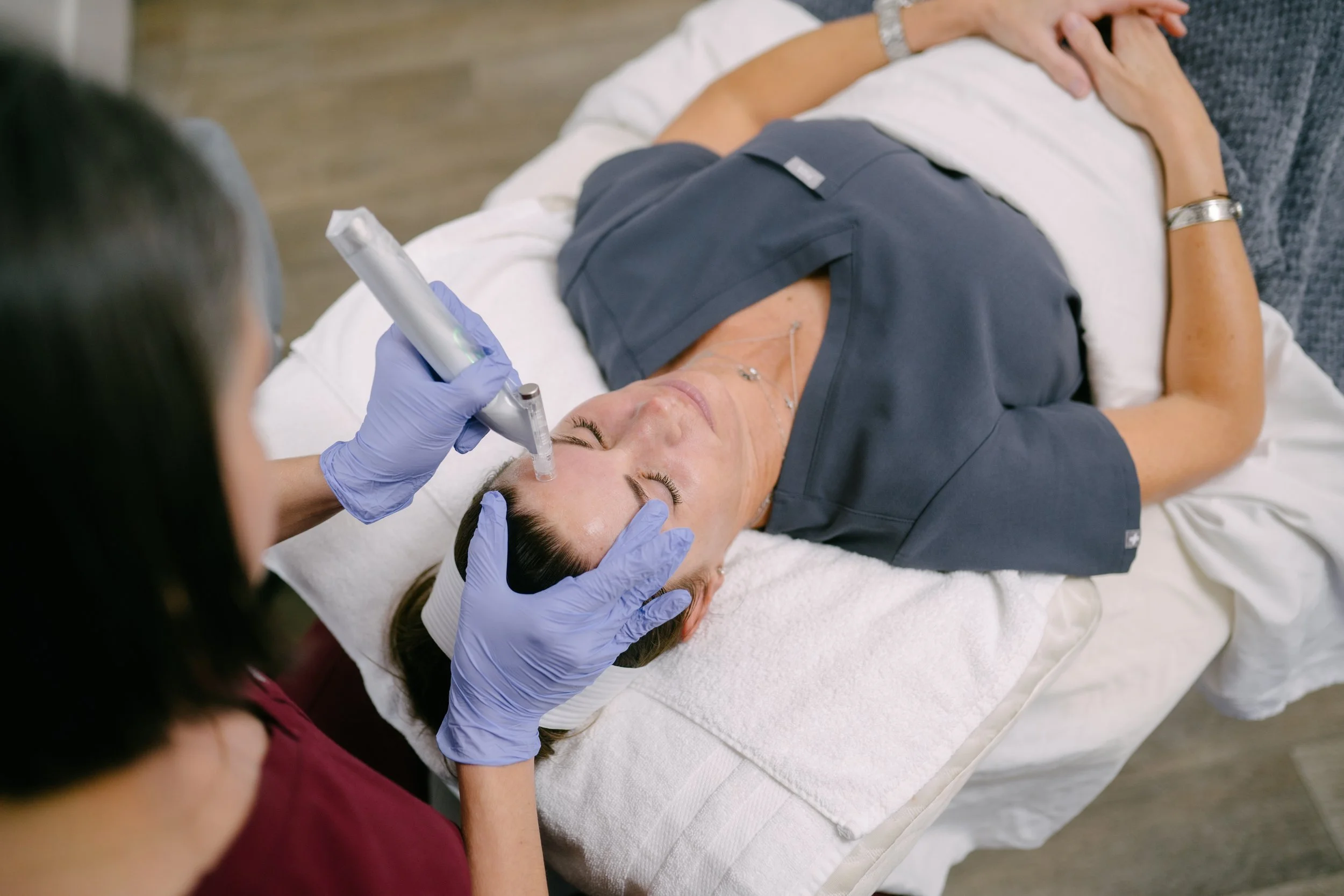 Patient receiving microneedling at O Young MD Kerrville