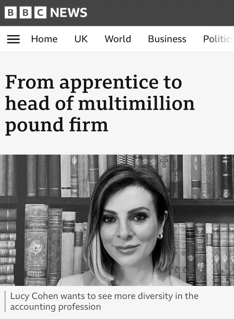 Black and white news article screenshot from BBC News featuring a woman in front of a bookshelf with the headline "From apprentice to head of multimillion pound firm" and a caption about Lucy Cohen promoting diversity in the accounting profession.