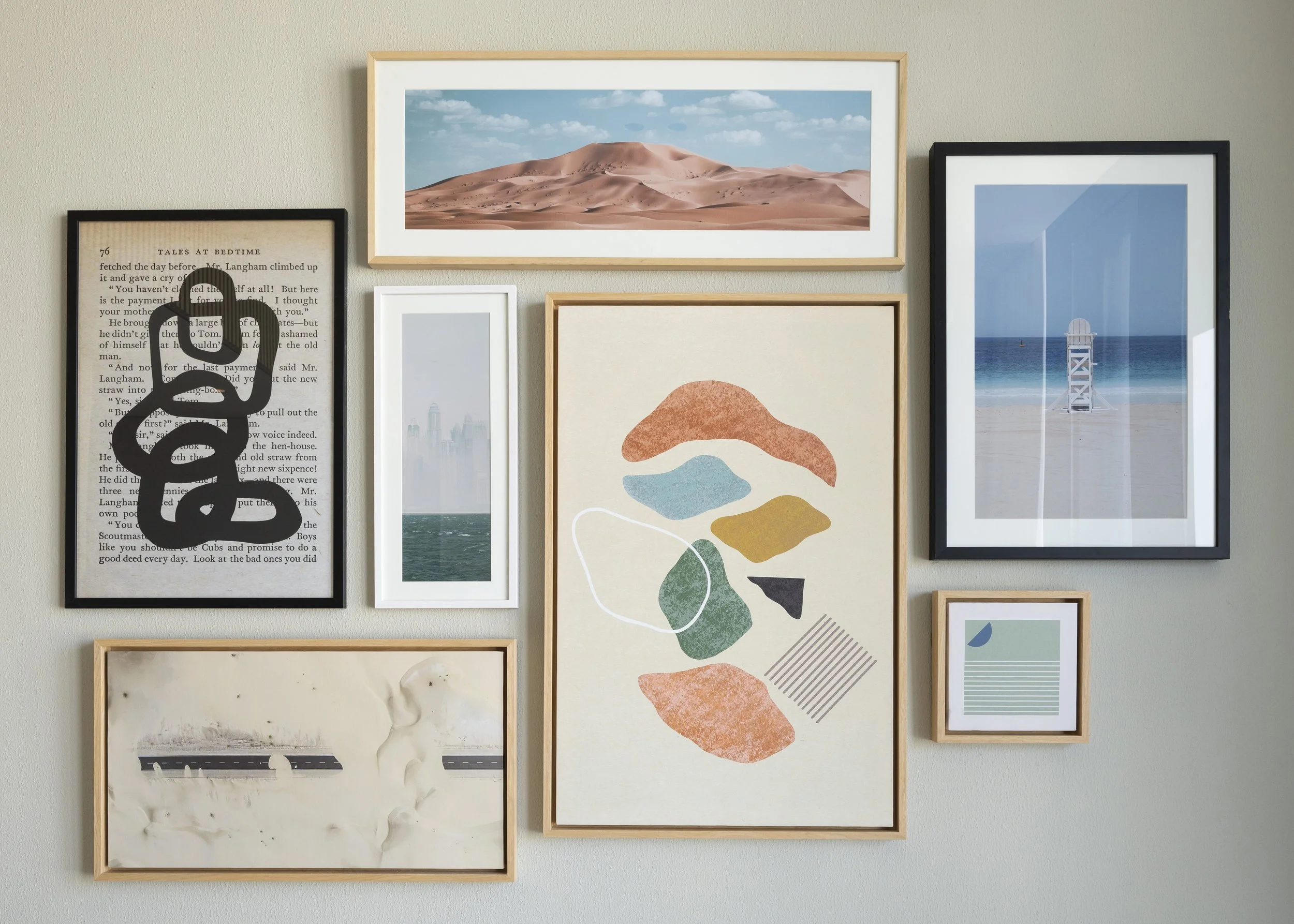 Several framed photographs of different settings and artworks of various geometric shapes.