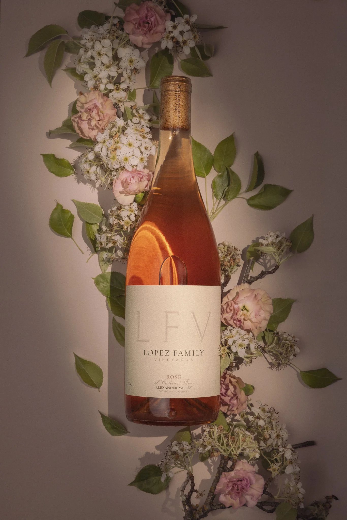 2025 Rosé of Cabernet Franc Bottle with floral background