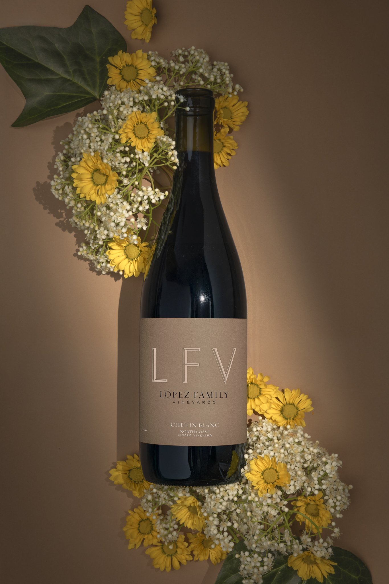 2024 Chenin Blanc with floral background.