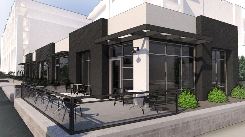 Modern building with outdoor seating, tables, and chairs on a patio, black and white exterior with large glass windows and a railing.