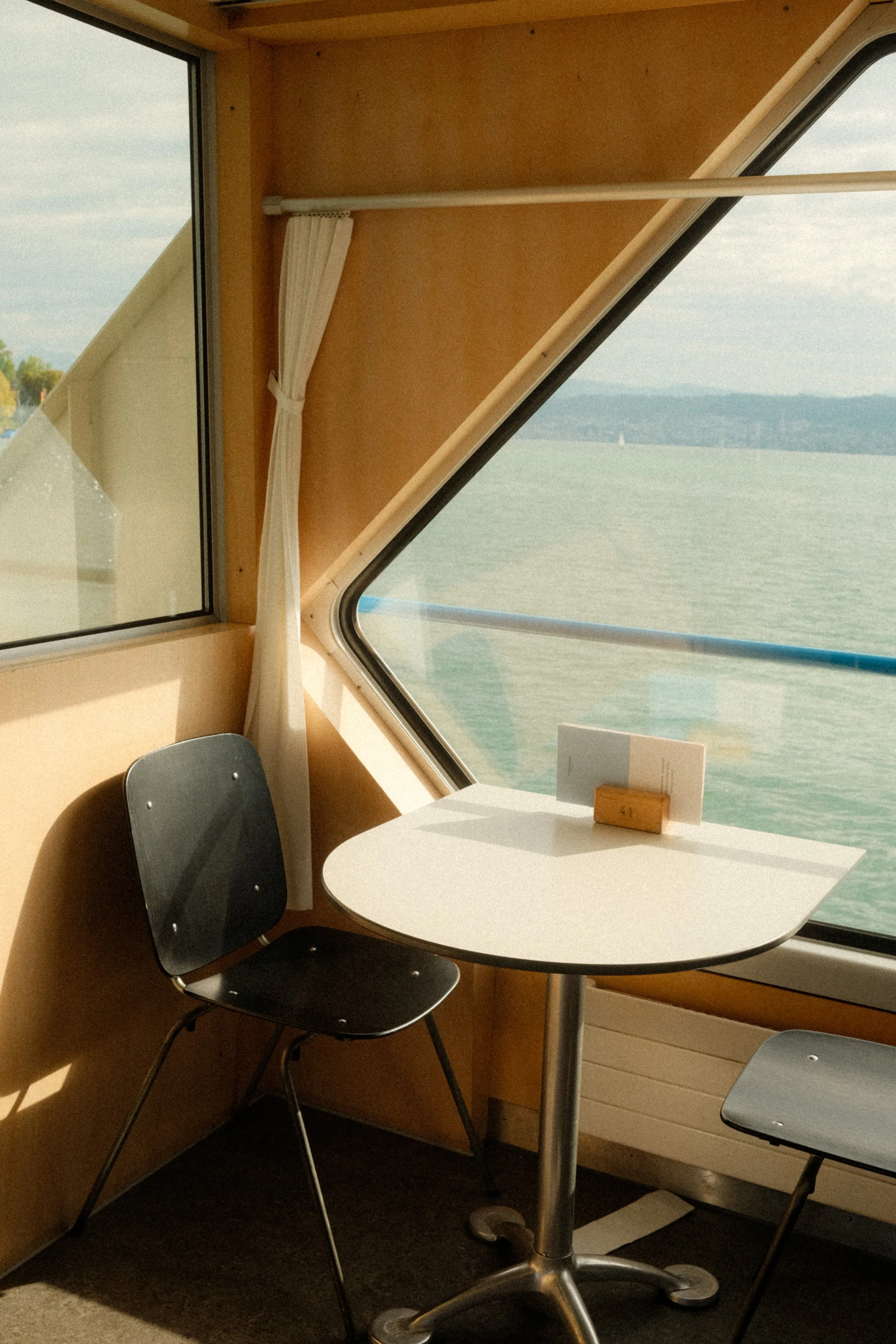 zurich-switzerland-lake-boat-cabin-window-lake-view-travel-photography-16.jpg