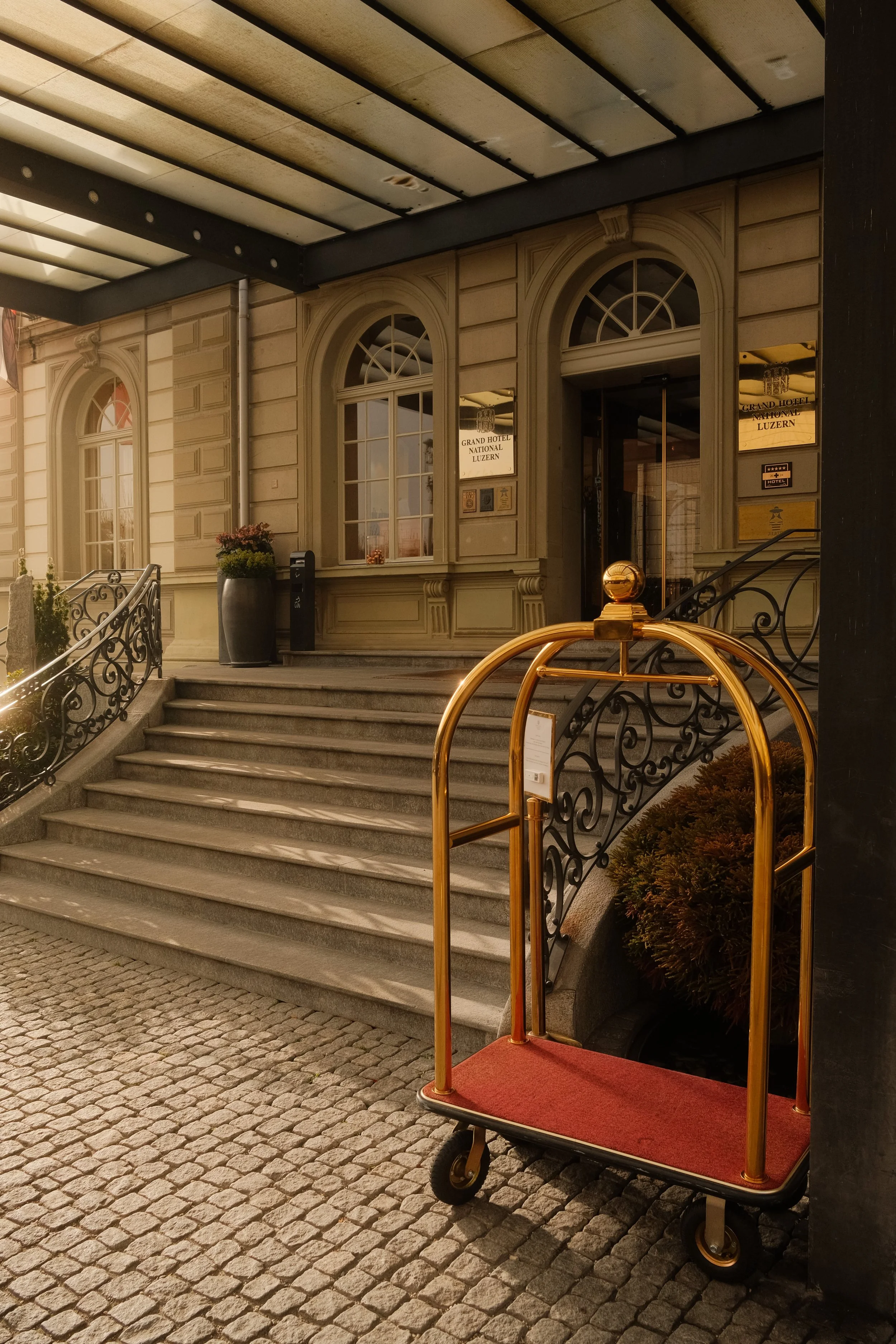 grand-hotel-national-lucerne-switzerland-hotel-entrance-luggage-cart-iron-railing-hospitality-photography-09.jpg
