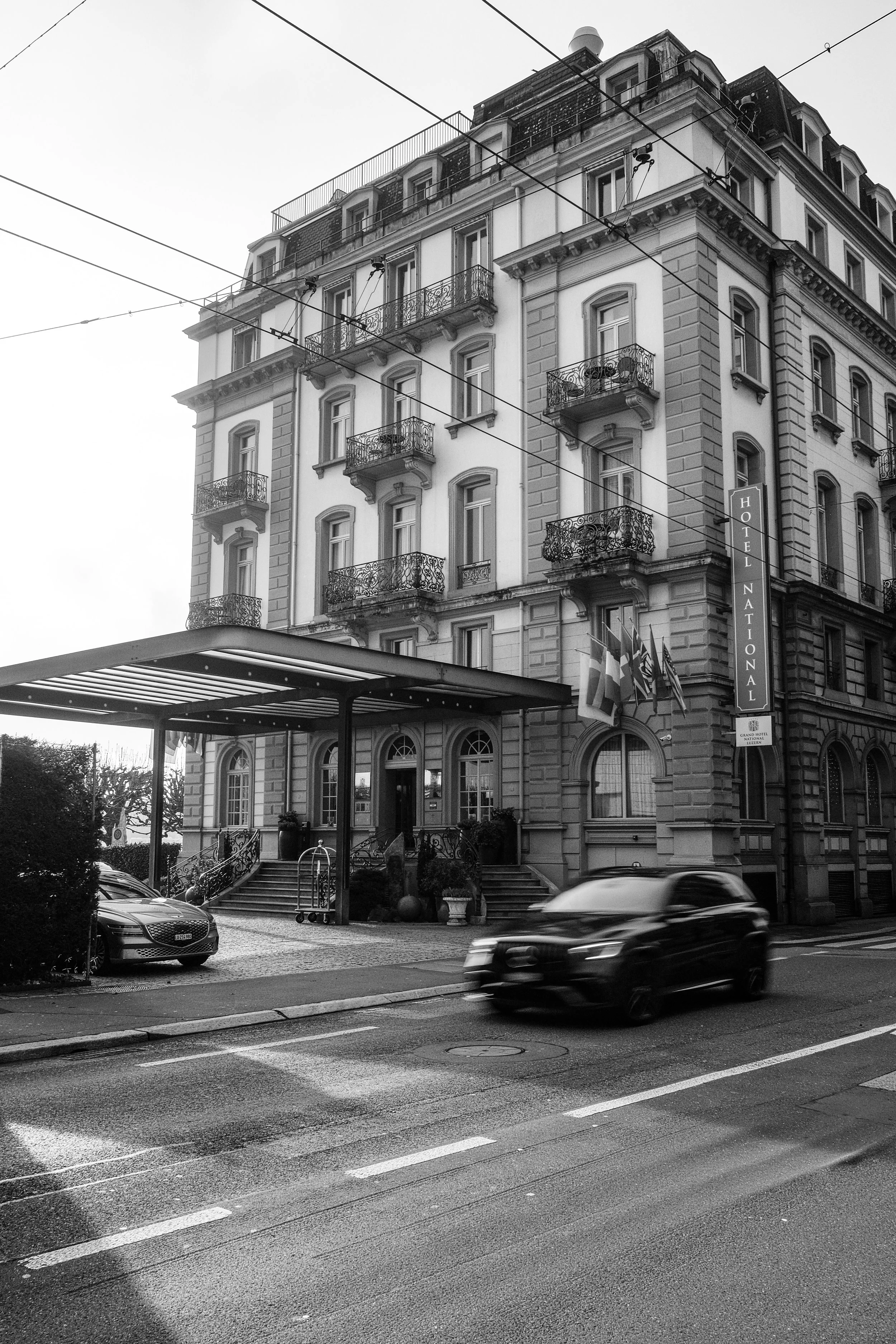 grand-hotel-national-lucerne-switzerland-hotel-exterior-street-black-white-hospitality-photography-10.jpg
