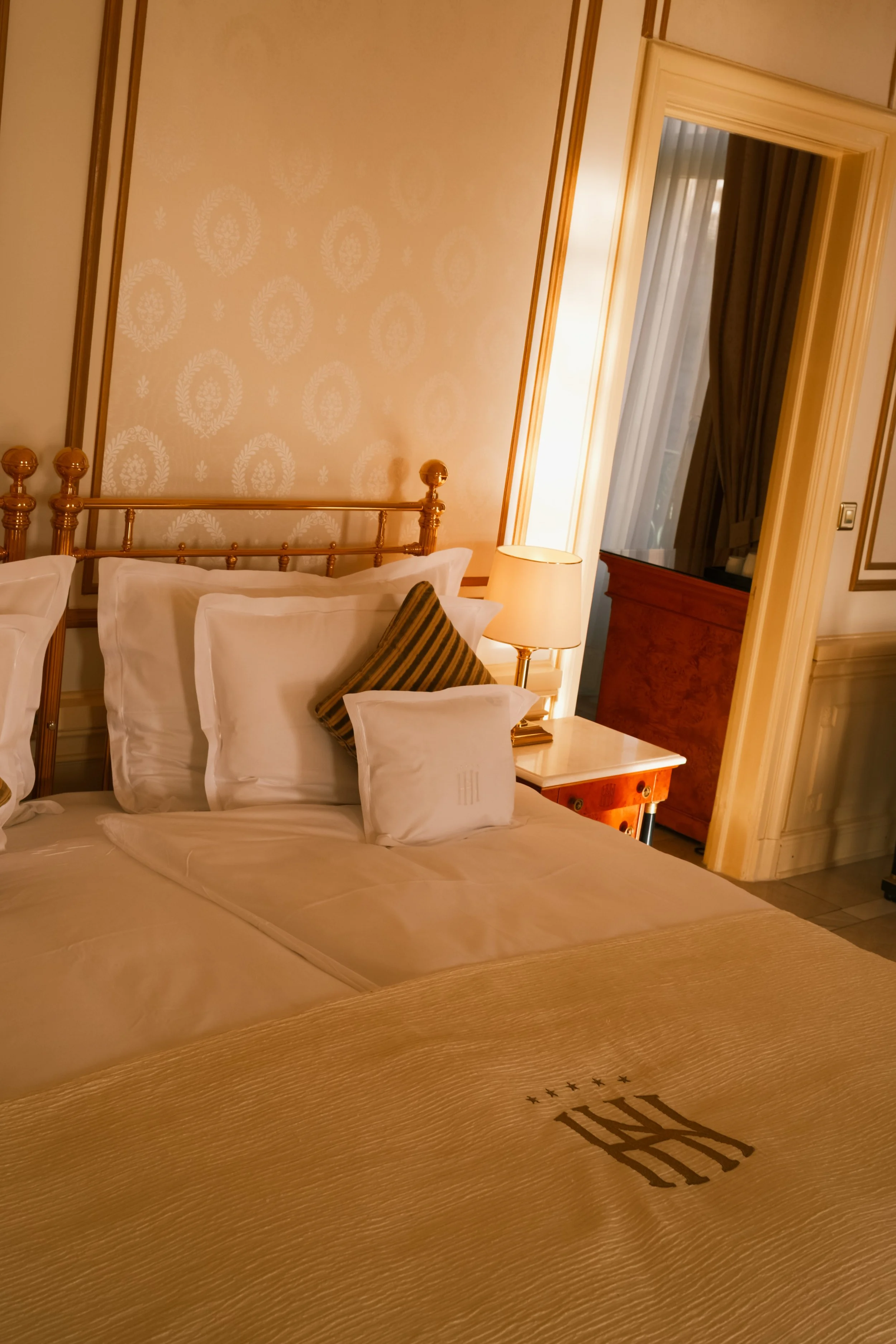 grand-hotel-national-lucerne-switzerland-luxury-room-brass-bed-monogram-bedding-hospitality-photography-03.jpg