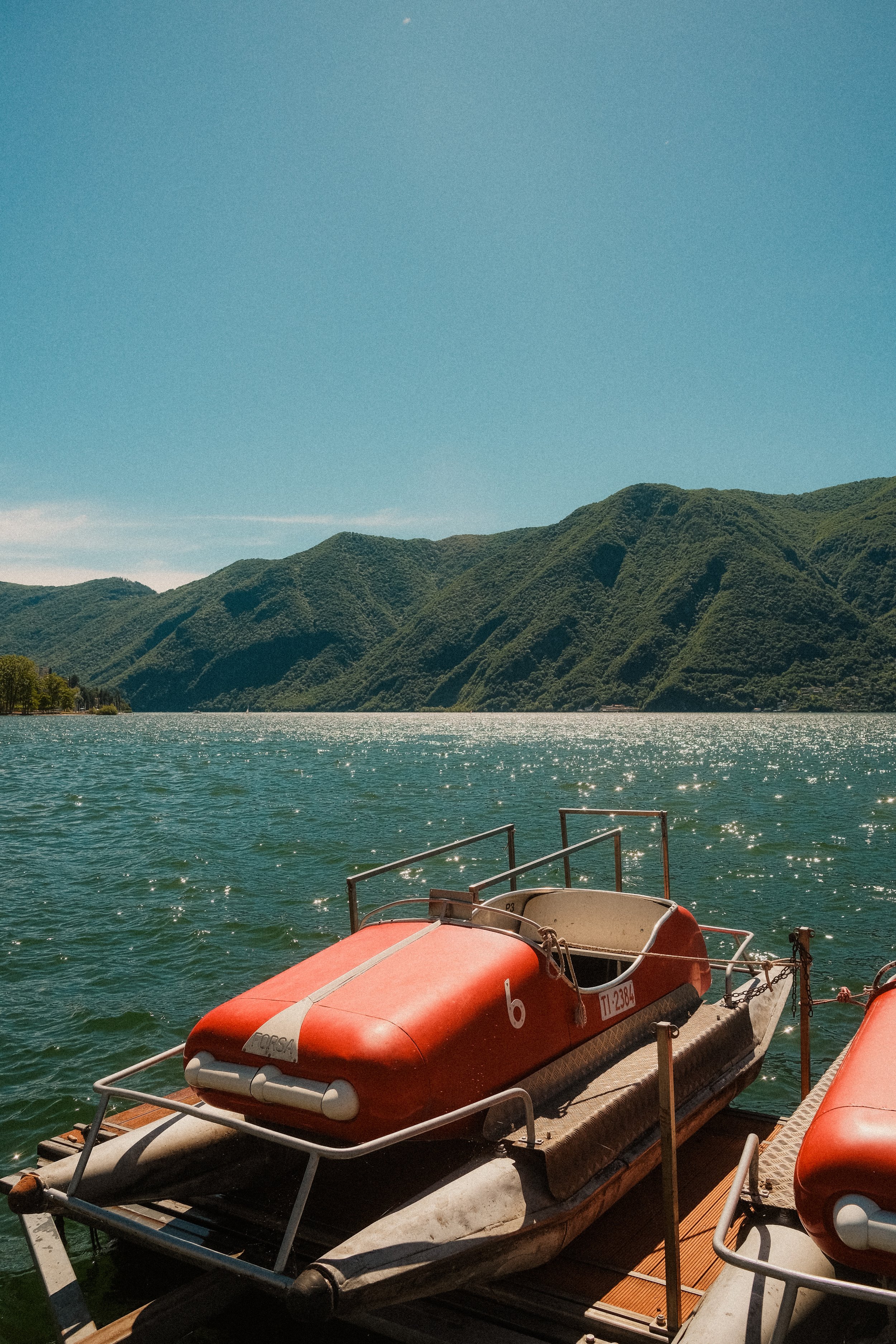 lake-lugano-switzerland-pedal-boats-dock-mountain-summer-travel-photography-47.jpg
