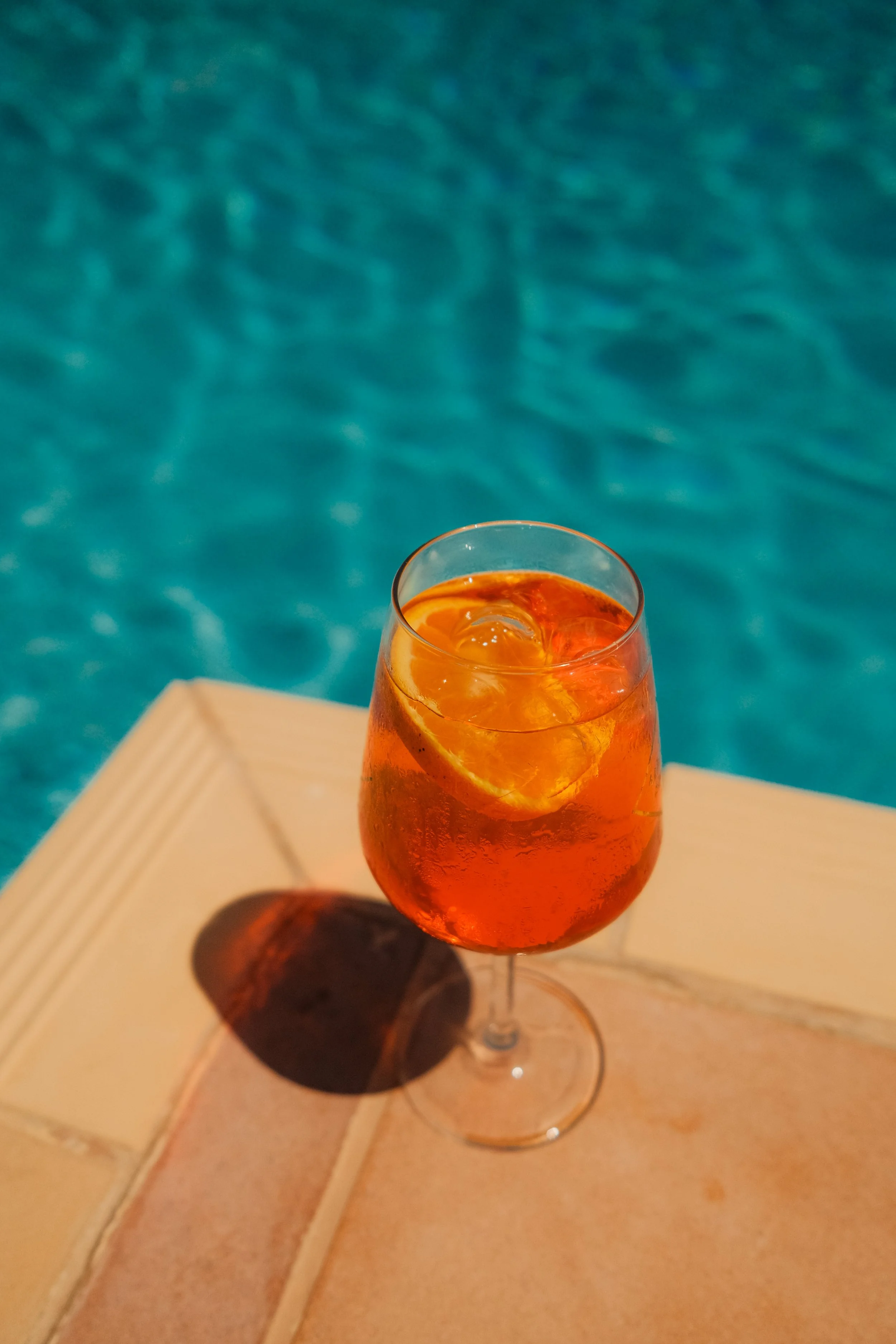 agapi-beach-resort-crete-greece-pool-aperol-spritz-cocktail-overhead-hospitality-photography-27.jpg