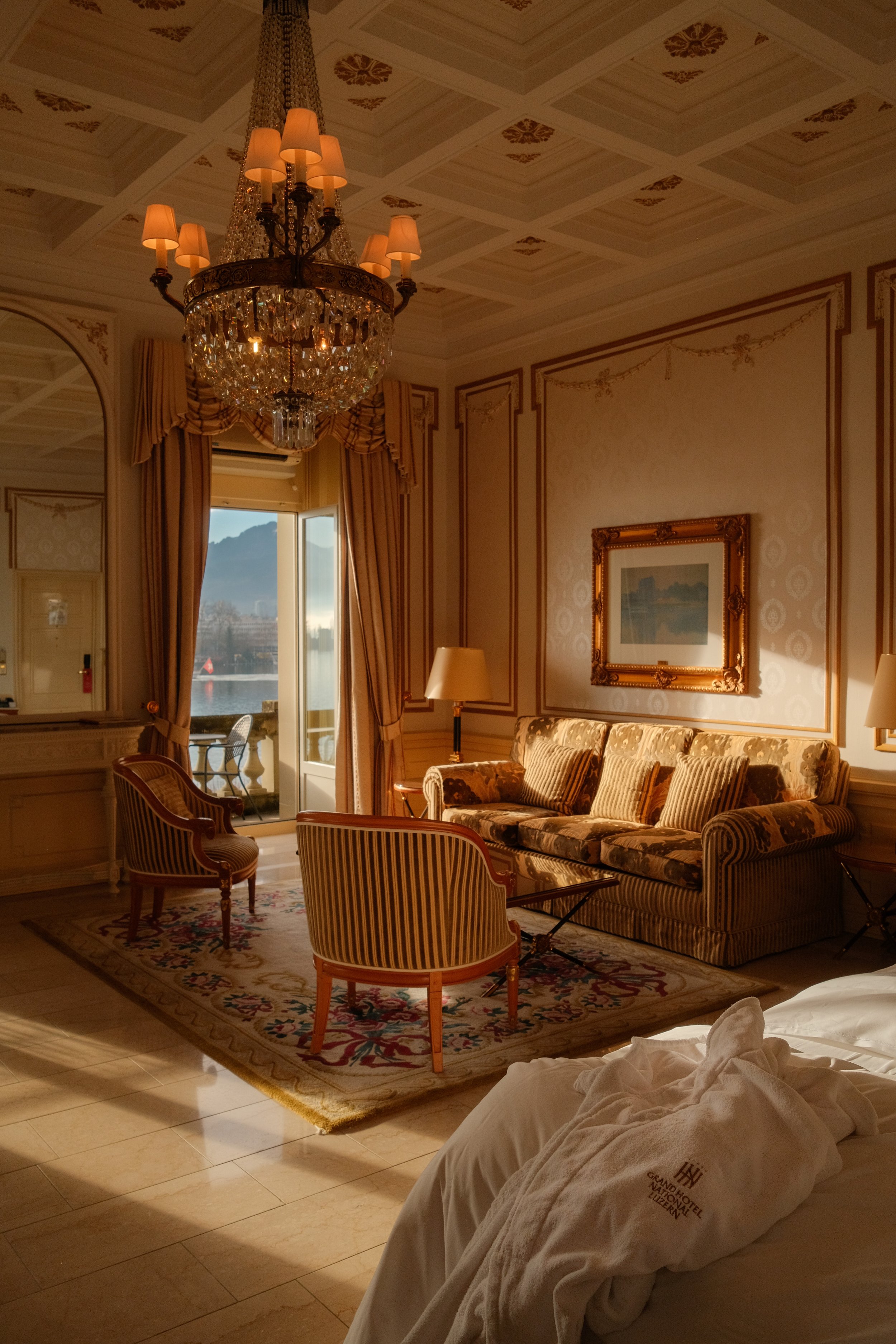 grand-hotel-national-lucerne-switzerland-luxury-suite-crystal-chandelier-striped-armchairs-hospitality-photography-26.jpg