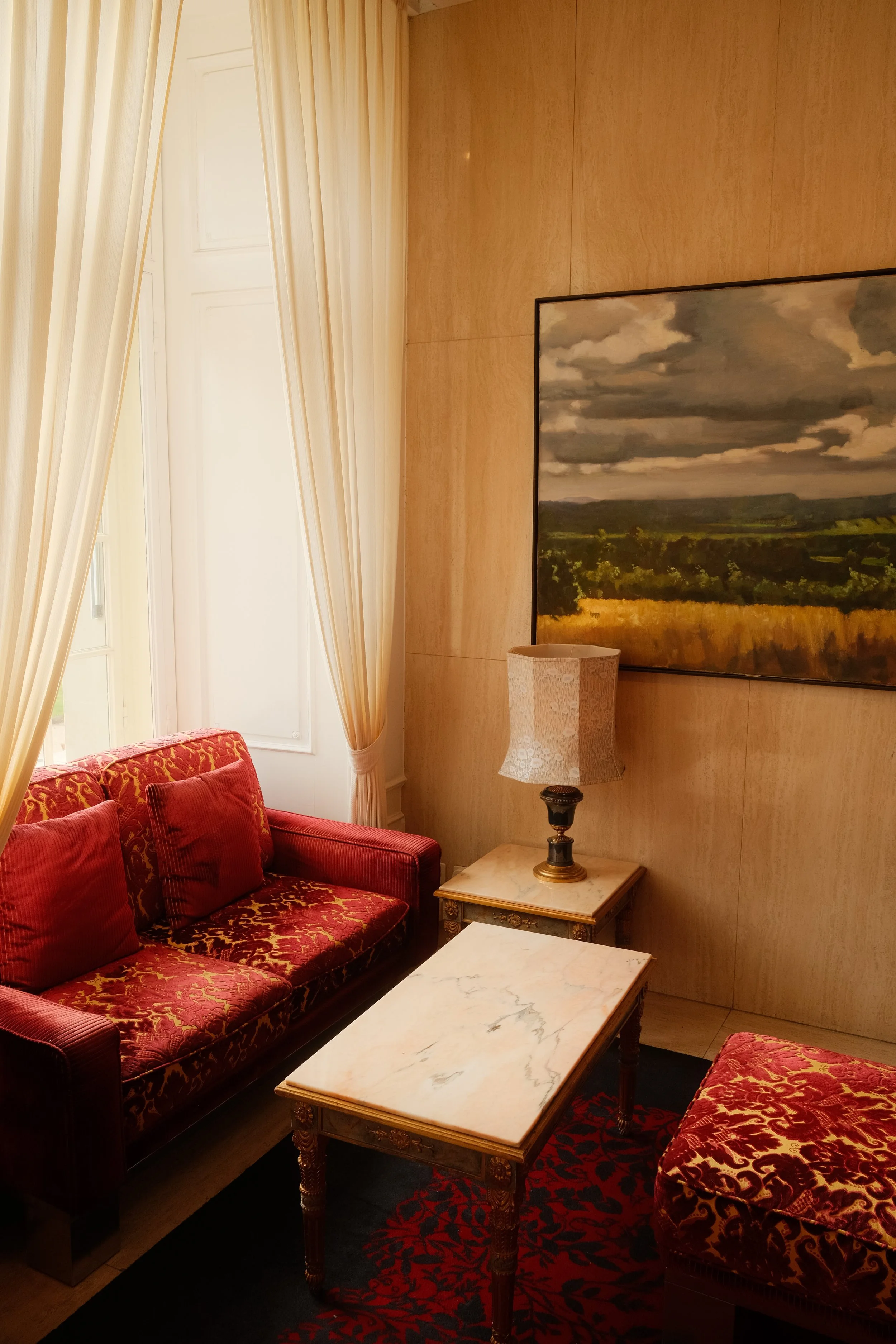 grand-hotel-national-lucerne-switzerland-hotel-suite-red-velvet-sofa-painting-hospitality-photography-07.jpg