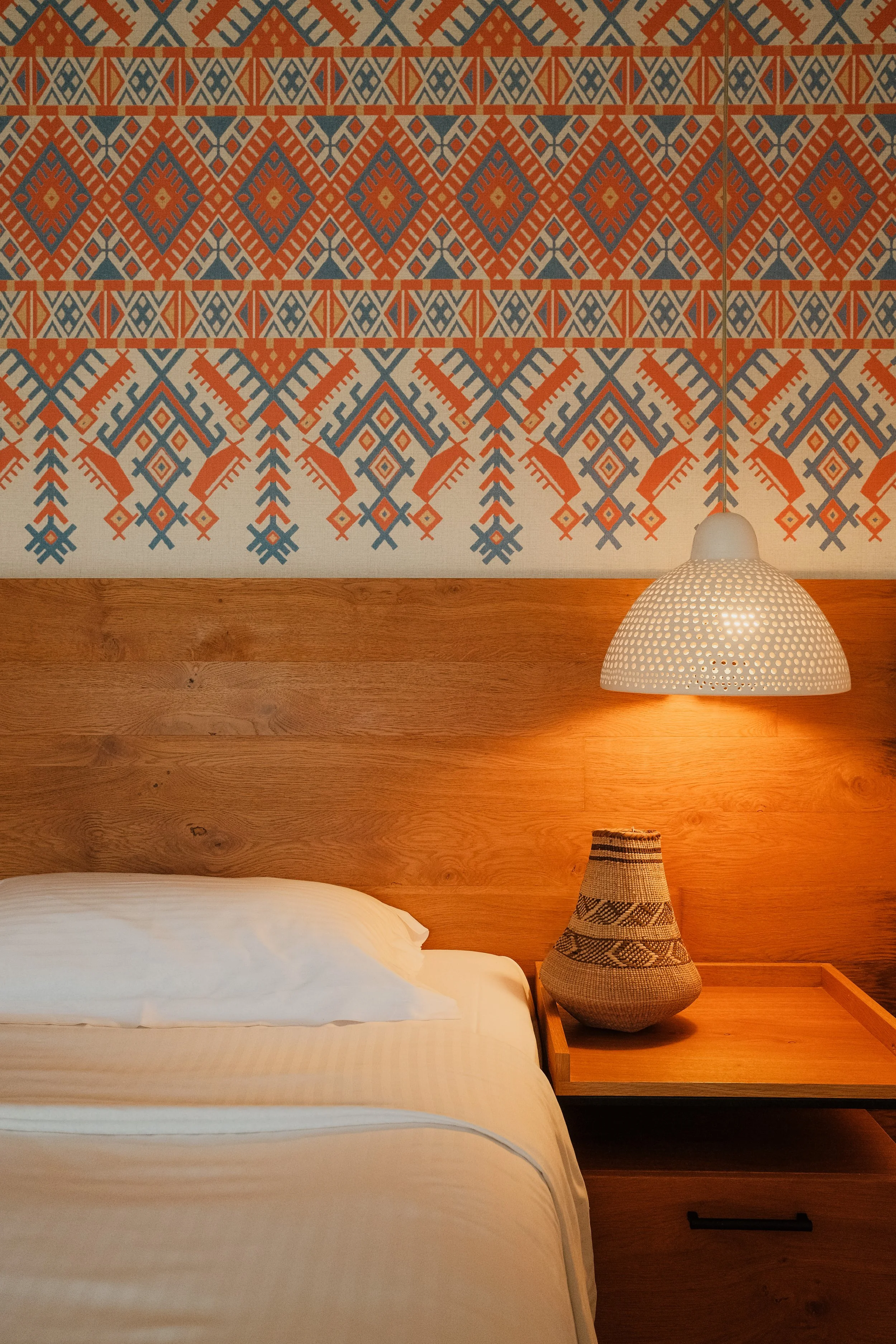 agapi-beach-resort-crete-greece-hotel-room-ethnic-geometric-wallpaper-wooden-headboard-lamp-hospitality-photography-06.jpg