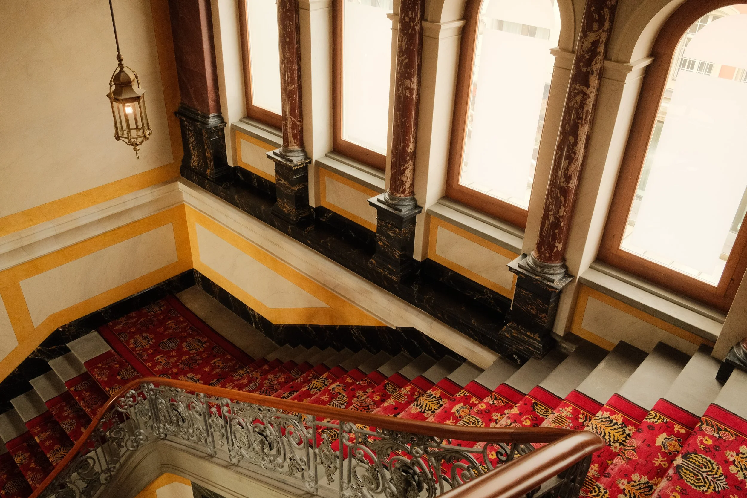 grand-hotel-national-lucerne-switzerland-grand-staircase-red-carpet-marble-columns-aerial-hospitality-photography-12.jpg