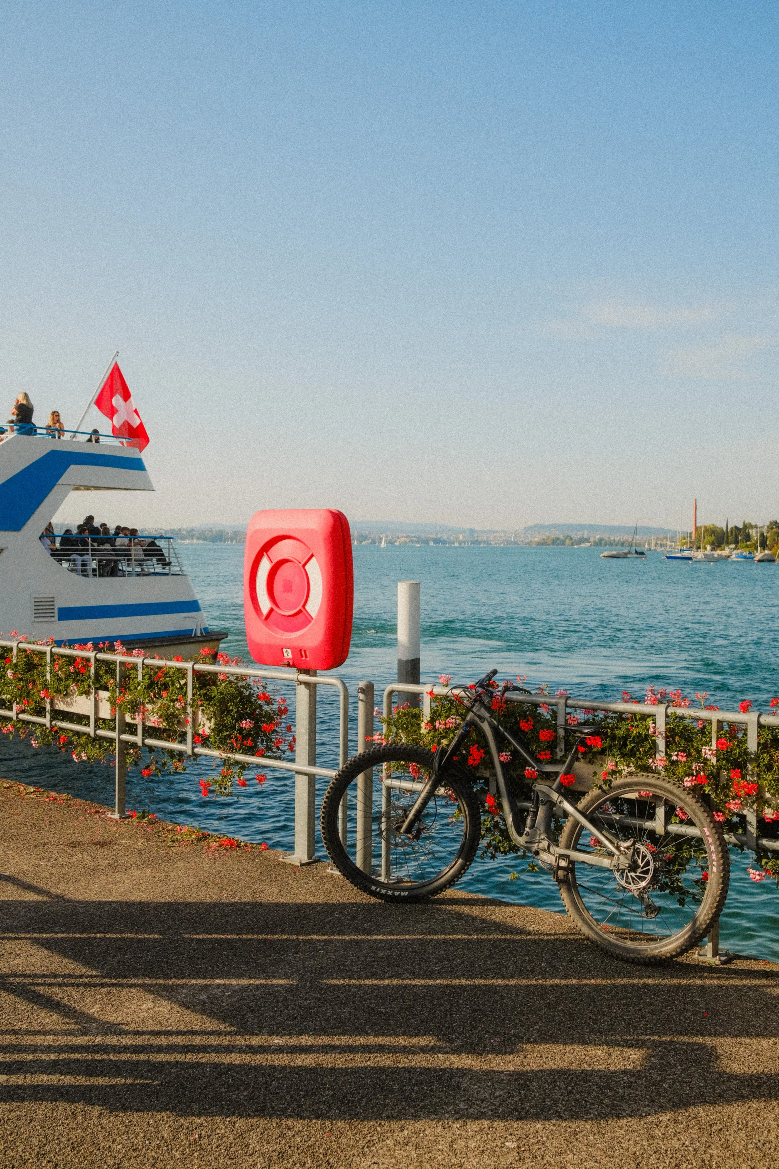 zurich-switzerland-lake-bicycle-ferry-swiss-flag-summer-travel-photography-18.jpg