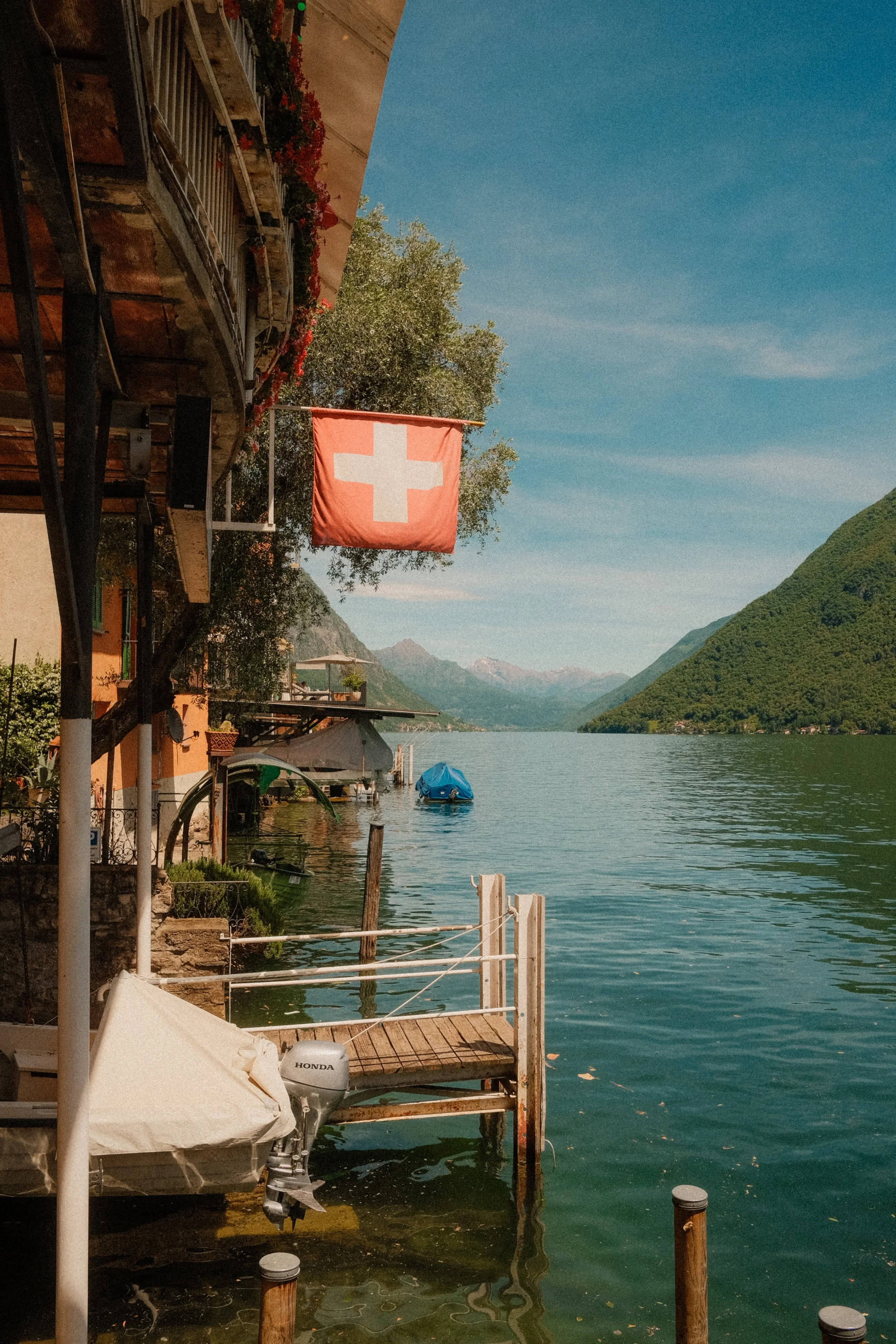 lake-lugano-switzerland-swiss-flag-waterfront-turquoise-lake-mountain-travel-photography-51.jpg