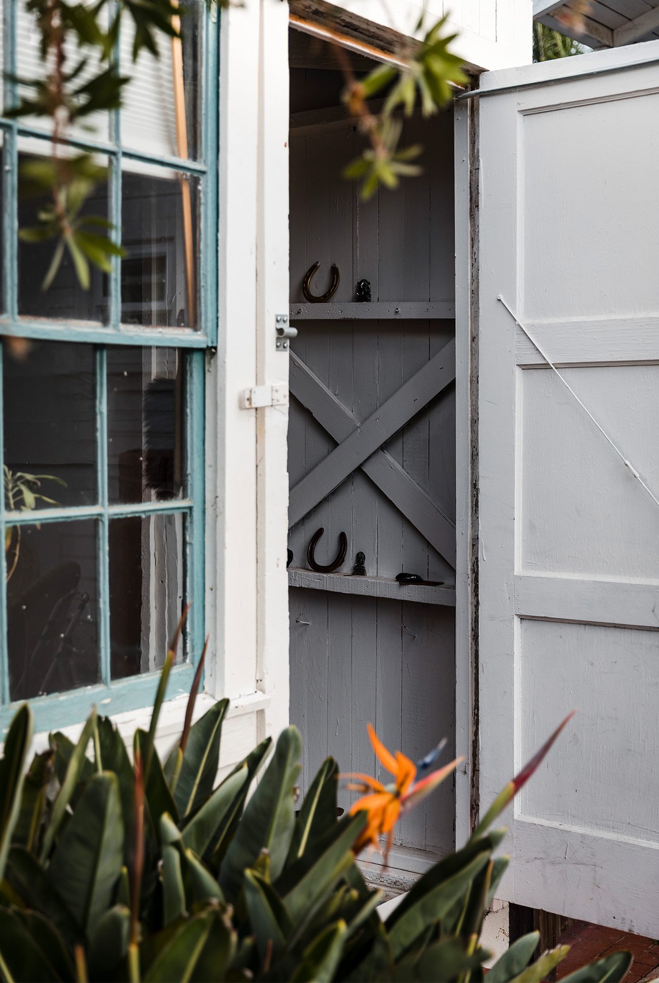 a door open to a gray barn interior