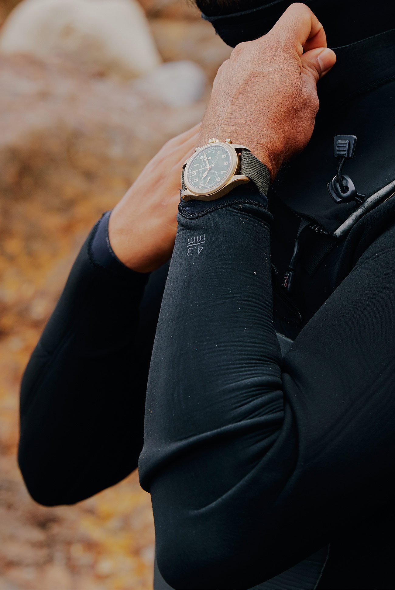 man adjusting his wetsuit