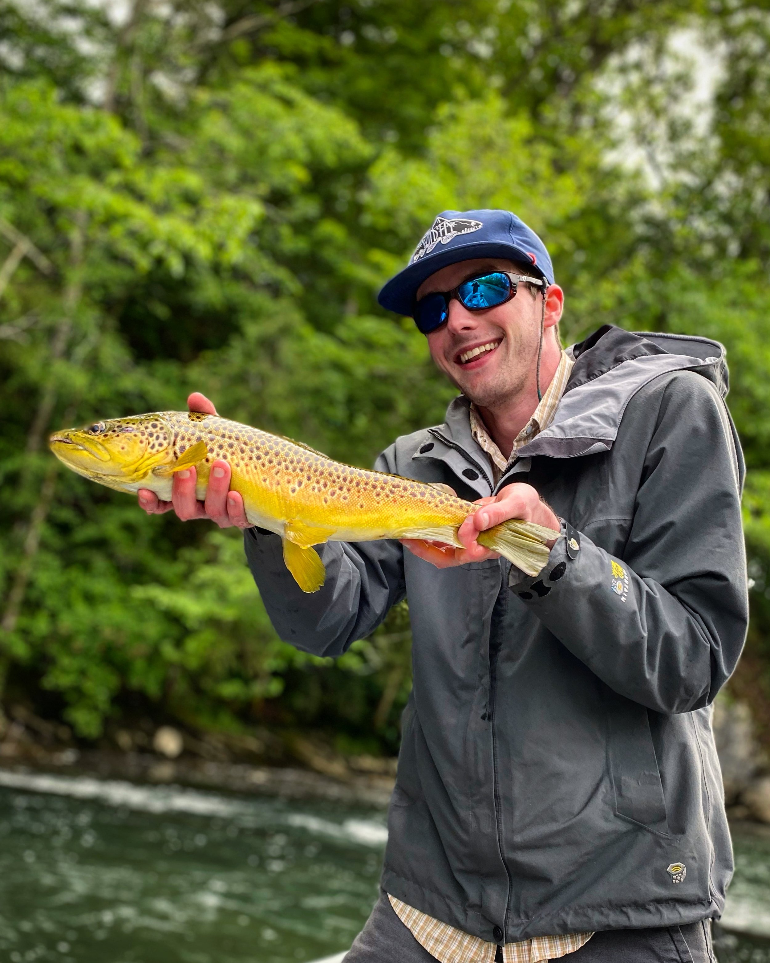 Brady Carter guide service client catches beautiful brown trout