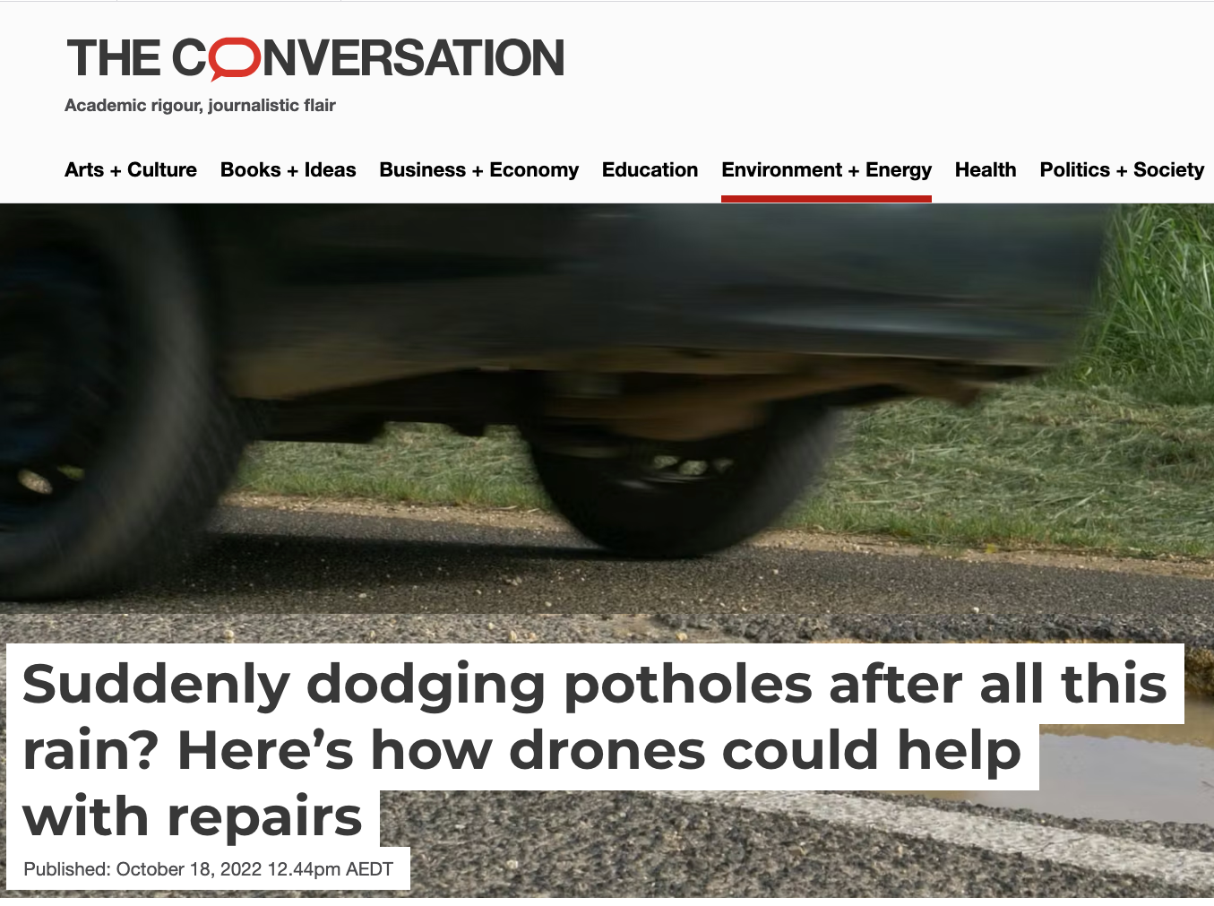 An article in The Conversation with a photo of a car and a pothole plus a headline