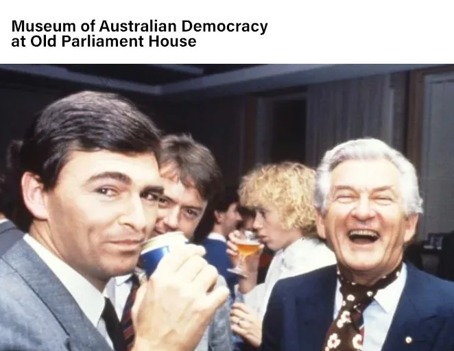 John Brumby and Bob Hawke share a celebratory beer at Old Parliament House, Canberra, 1988. Photo by Robert McFarlane via Museum of Australian Democracy.