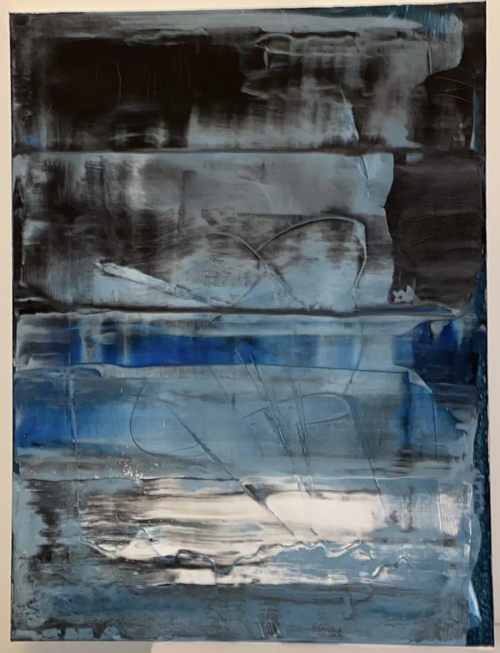 Abstract artwork with horizontal brushstrokes in shades of blue, black, grey, and white.