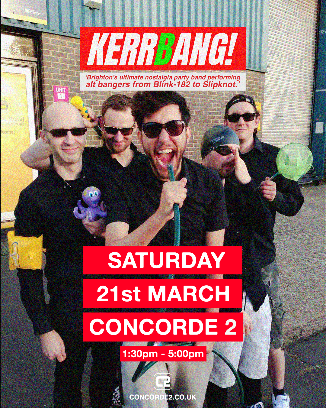 Group of five men outdoors, wearing black shirts and sunglasses, with one holding a green balloon and another holding a purple octopus toy, smiling and having fun.