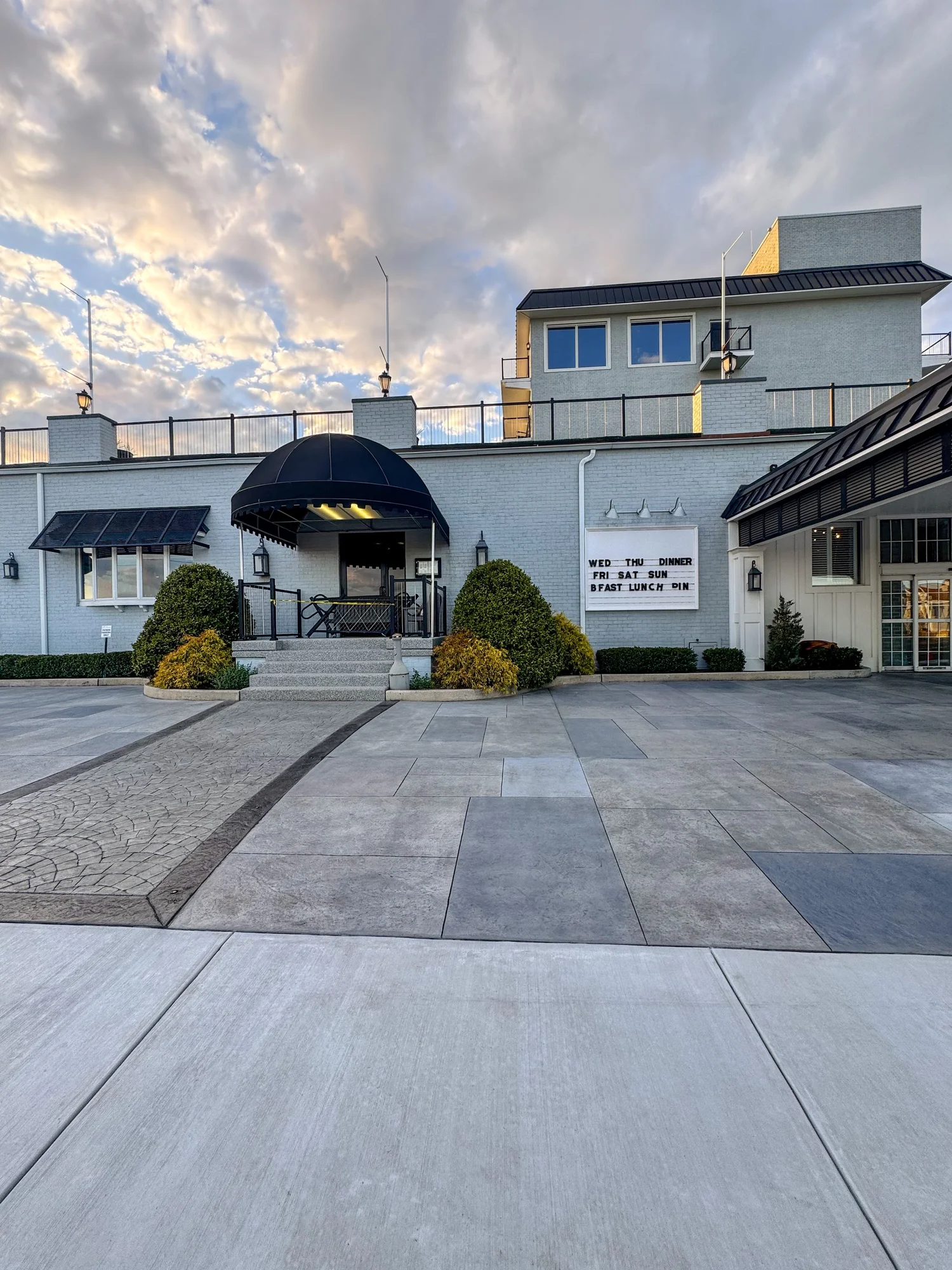 Large proportion bluestone stamped concrete with multitone color and relief joints placed within the pattern, Grand Hotel Cape May NJ by Patrick Breen