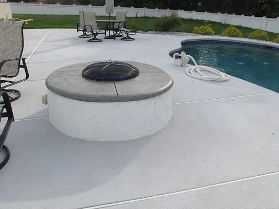 Close-up of a custom outdoor kitchen island with stone veneer and stone countertop by Patrick Breen Masonry & Concrete