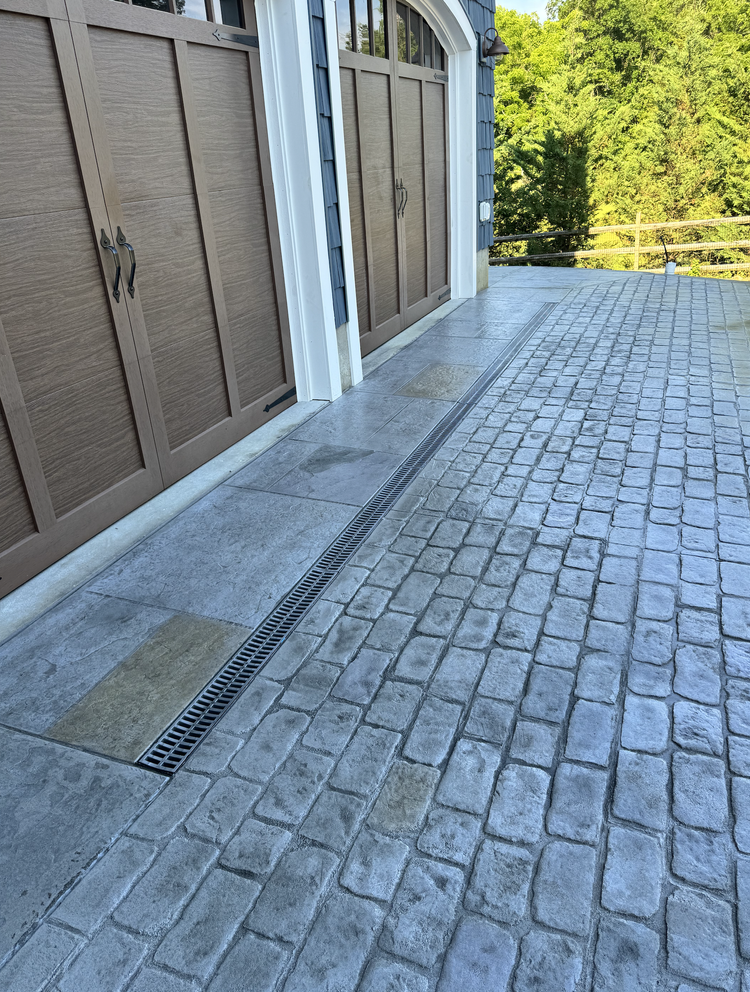 Modern stamped concrete driveway installation