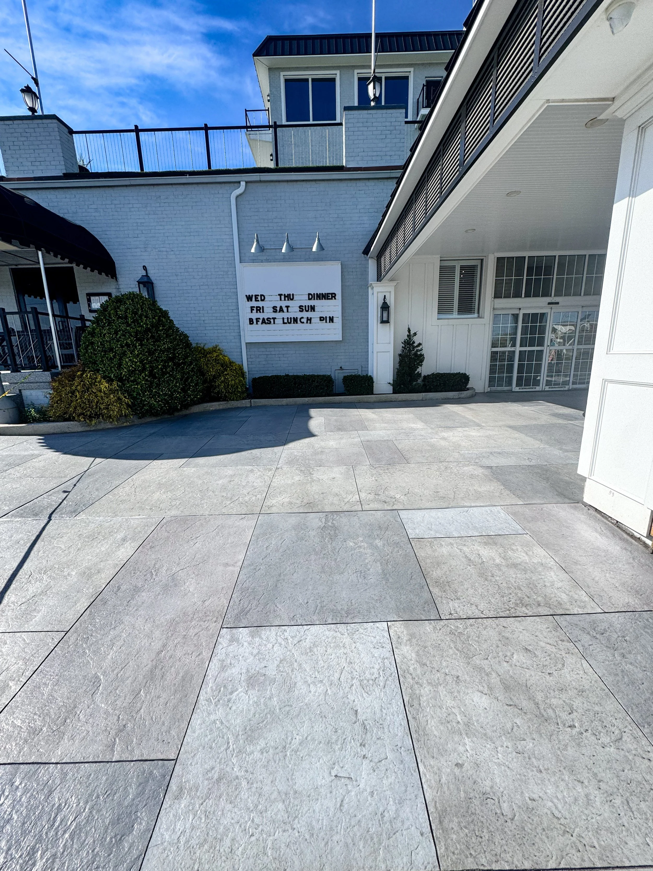 Gray ashlar slate stamped concrete patio at a commercial property in South Jersey by Patrick Breen Concrete